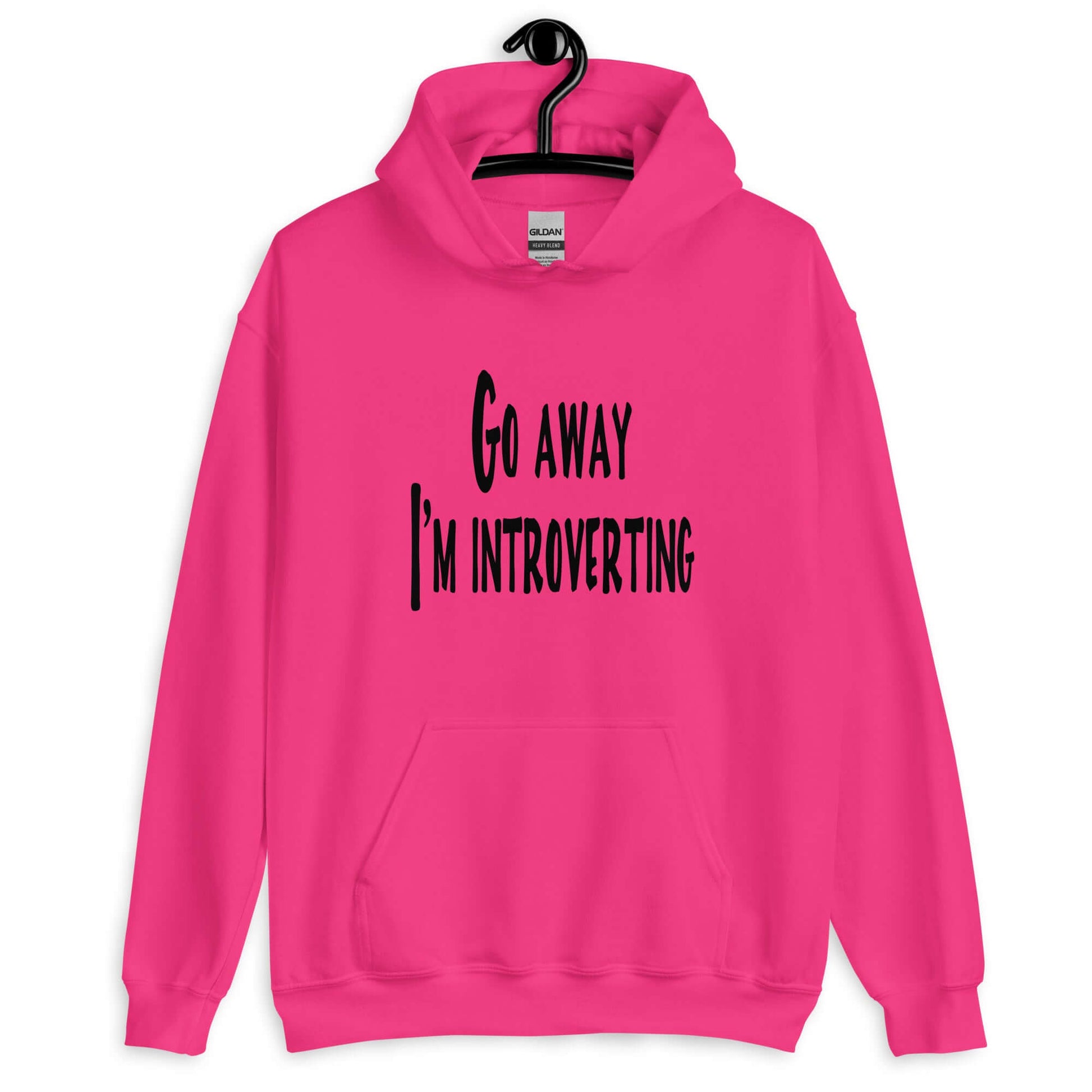 Heliconia pink hoodie sweatshirt with the phrase Go away, I'm introverting printed on the front.