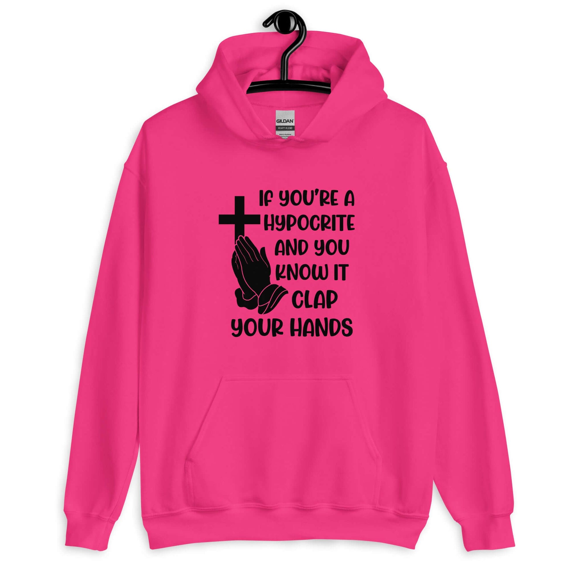 Heliconia pink hoodie sweatshirt with image of a cross and praying hands & the phrase If you're a hypocrite and you know it clap your hands printed on the front.