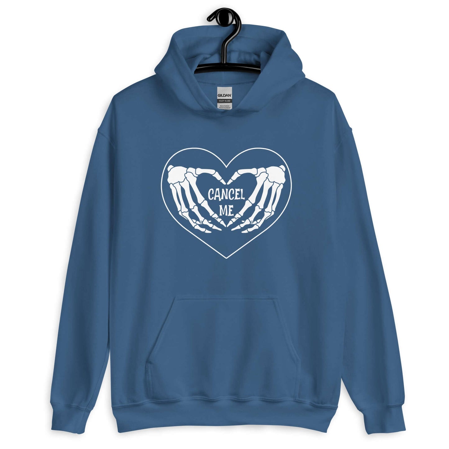 Indigo blue hoodie sweatshirt with a black heart and skeleton hands making a heart shape printed on the front. The words Cancel Me are inside of the heart.