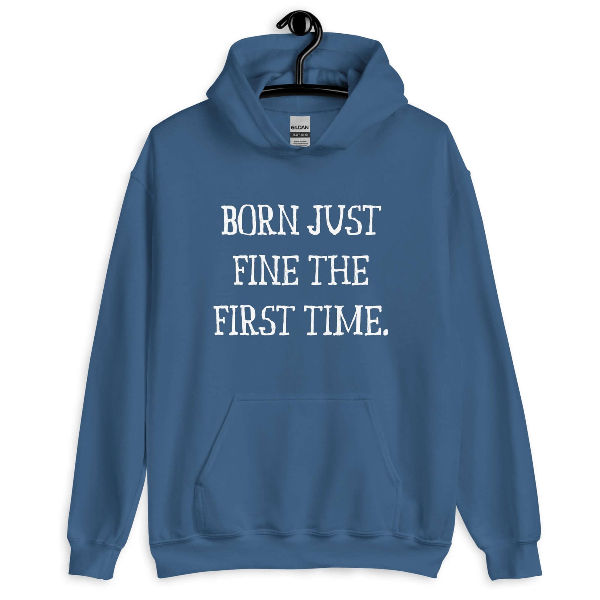 Indigo blue hoodie sweatshirt with the phrase Born just fine the first time printed on the front.