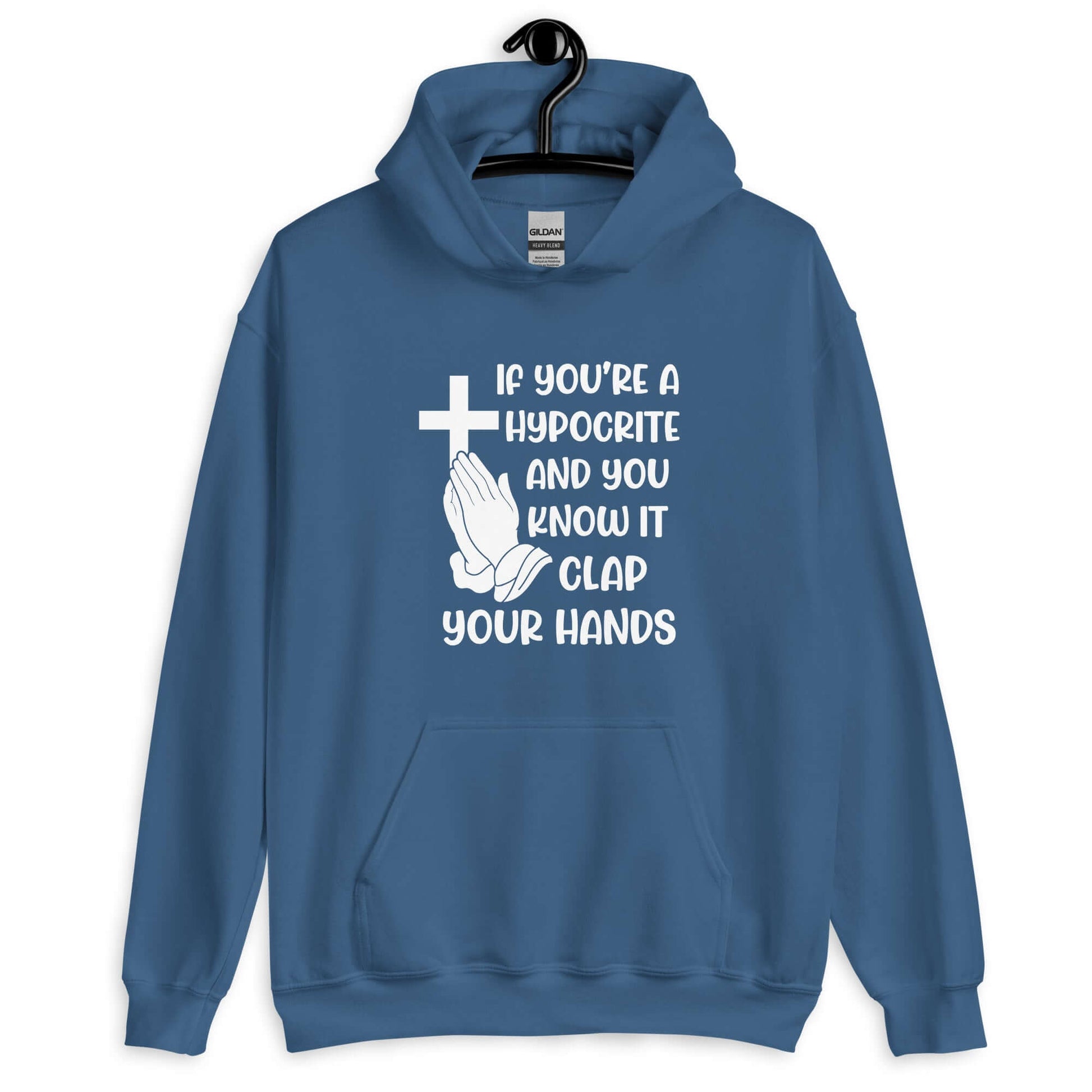 Indigo blue hoodie sweatshirt with image of a cross and praying hands & the phrase If you're a hypocrite and you know it clap your hands printed on the front.