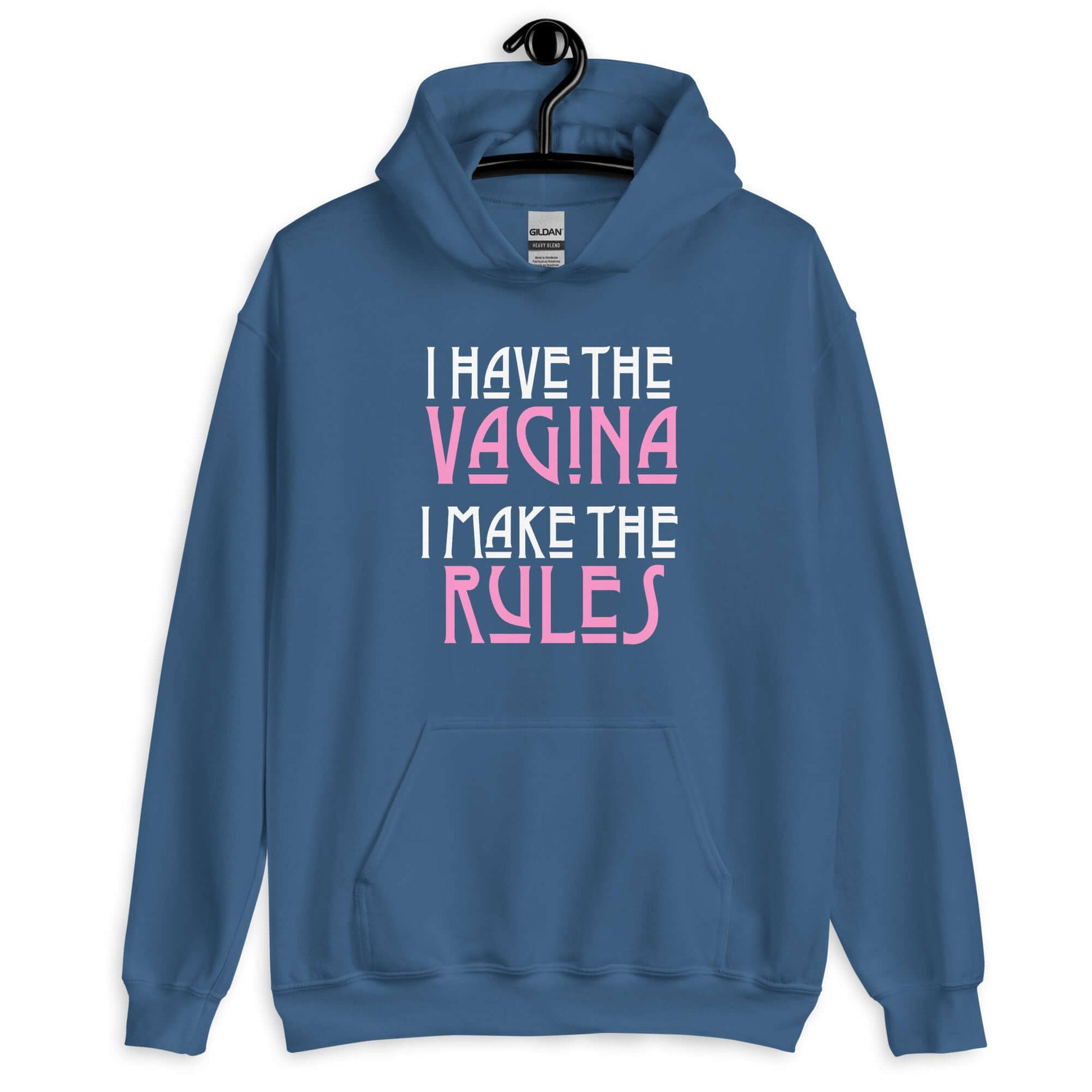 Indigo blue hoodie sweatshirt with the words I have the vagina , I make the rules printed on the front. The words vagina and rules are pink, the rest of the words are white.