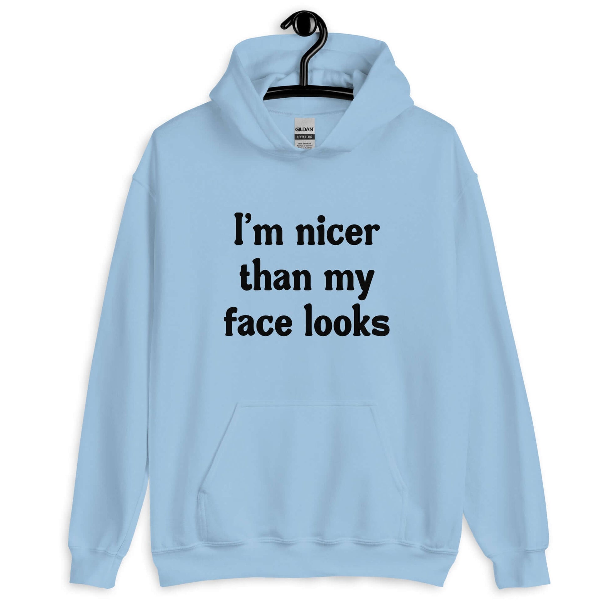 Light blue hoodie sweatshirt with the phrase I'm nicer than my face looks printed on the front.