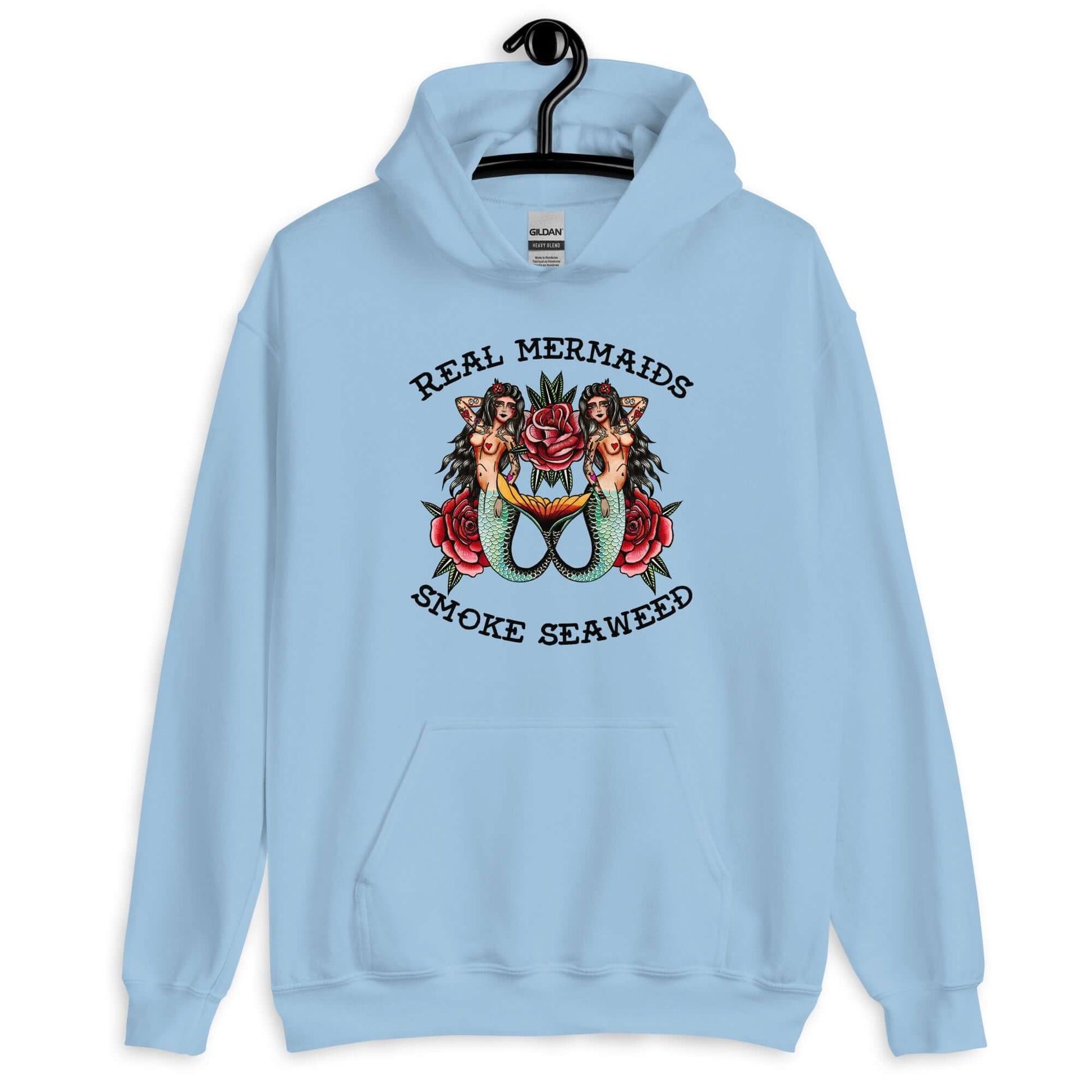 Light blue hoodie sweatshirt with image of 2 mermaids and the words Real mermaids smoke seaweed printed on the front.