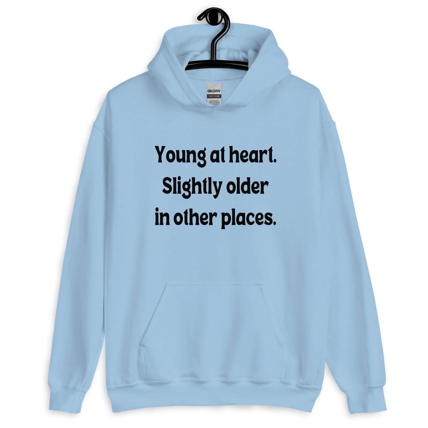 Light blue hoodie sweatshirt with the words Young at heart, slightly older in other places printed on the front.