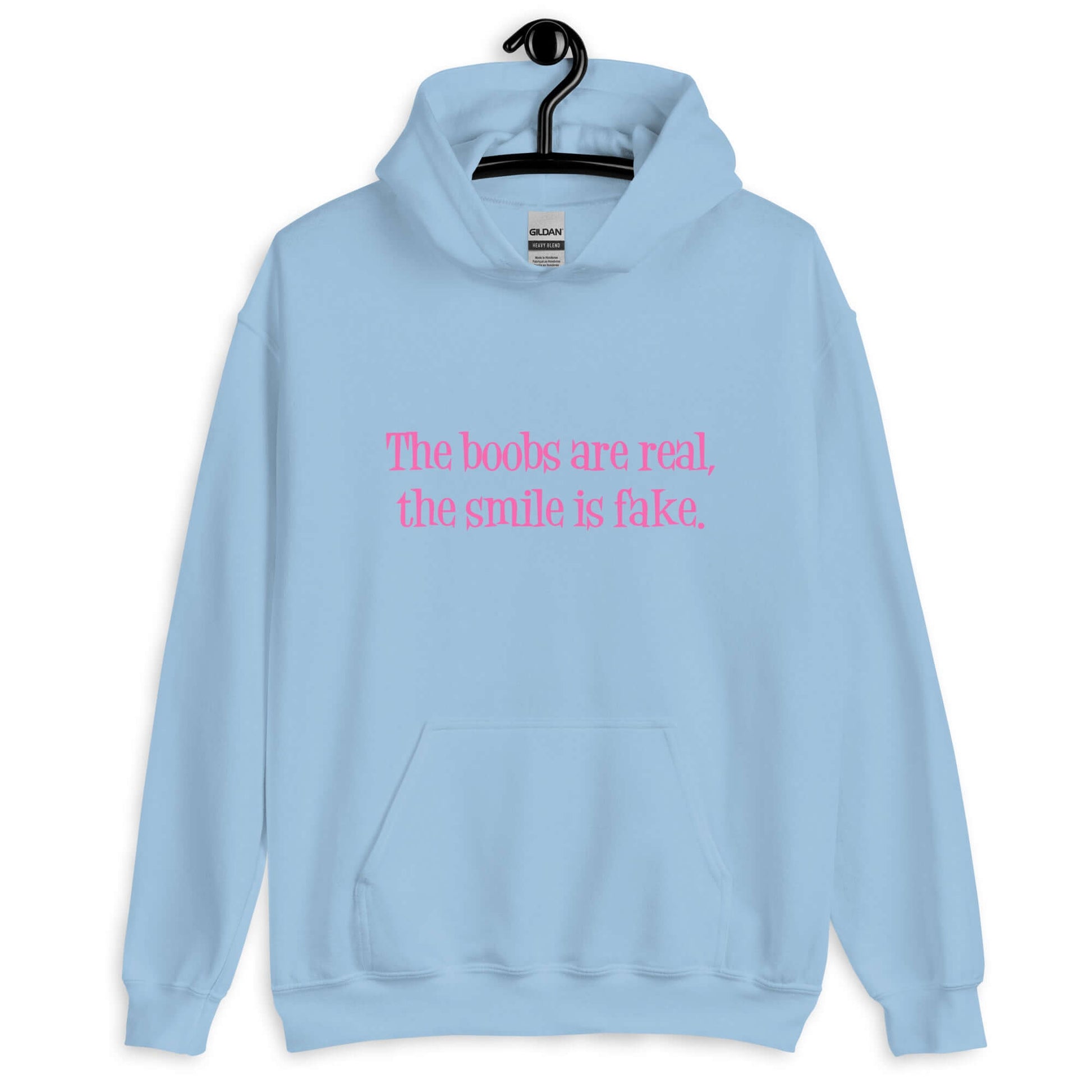 Light blue hoodie sweatshirt with the phrase The boobs are real, the smile is fake printed in pink on the front.