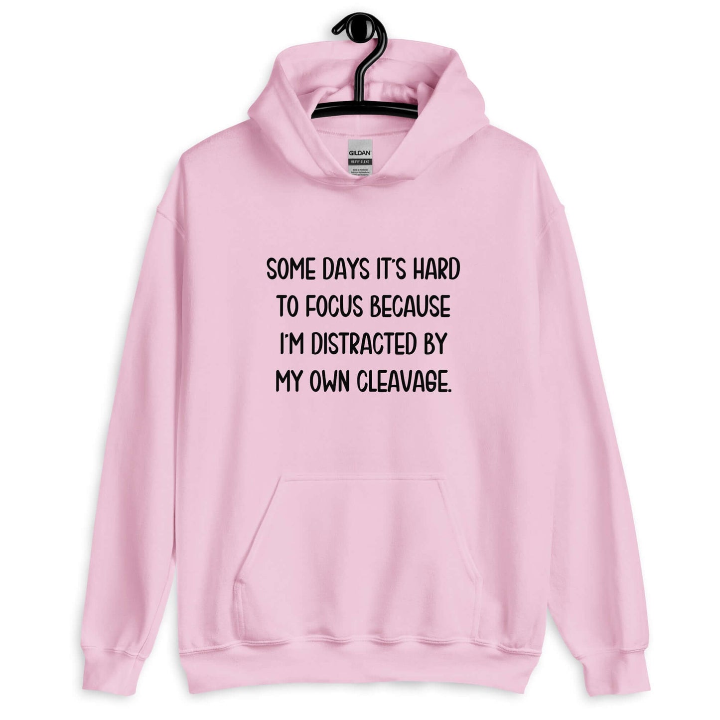 Light pink hoodie sweatshirt with the phrase Some days it's hard to focus because I'm distracted by my own cleavage printed on the front.