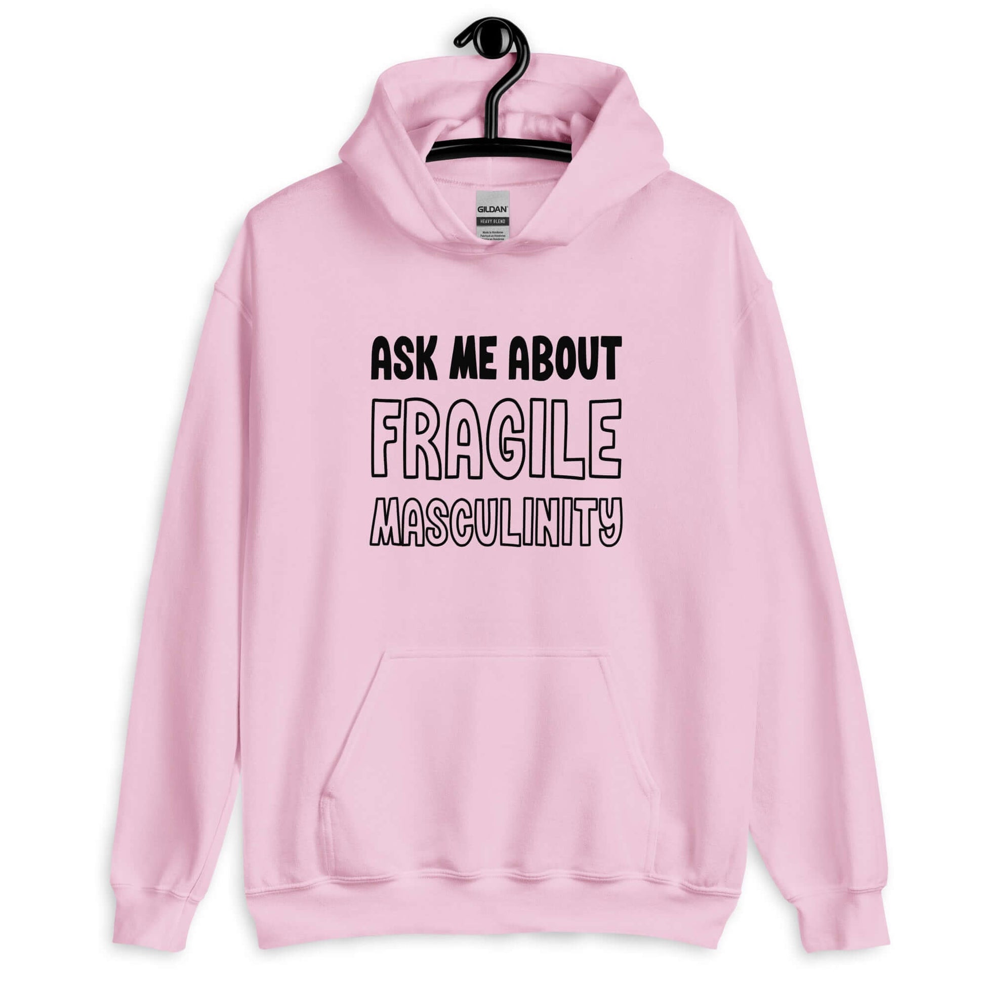 Light pink hoodie sweatshirt with the phrase Ask me about fragile masculinity printed on the front.