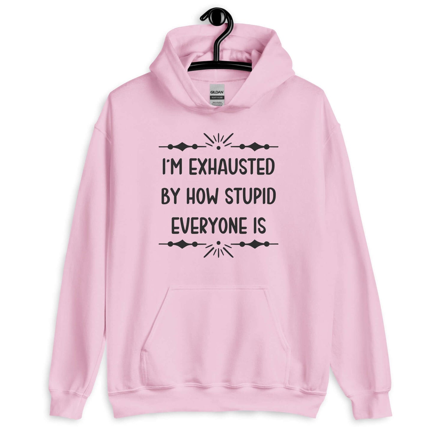 Light pink hoodie sweatshirt with the phrase I'm exhausted by how stupid everyone is. The graphics are printed on the front of the hoodie.