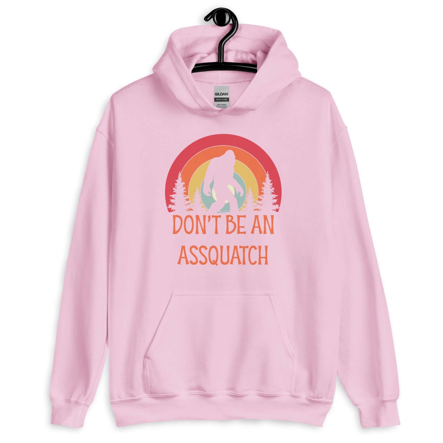 Light pink hoodie sweatshirt with sasquatch graphic and the words don't be an assquatch printed on the front.