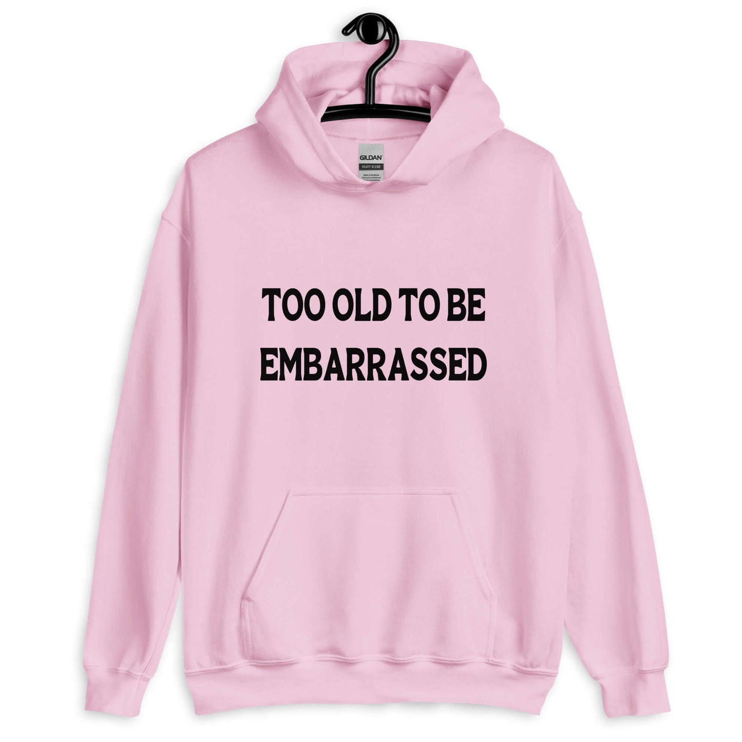 Light pink hooded sweatshirt with the words Too old to be embarrassed printed on the front.