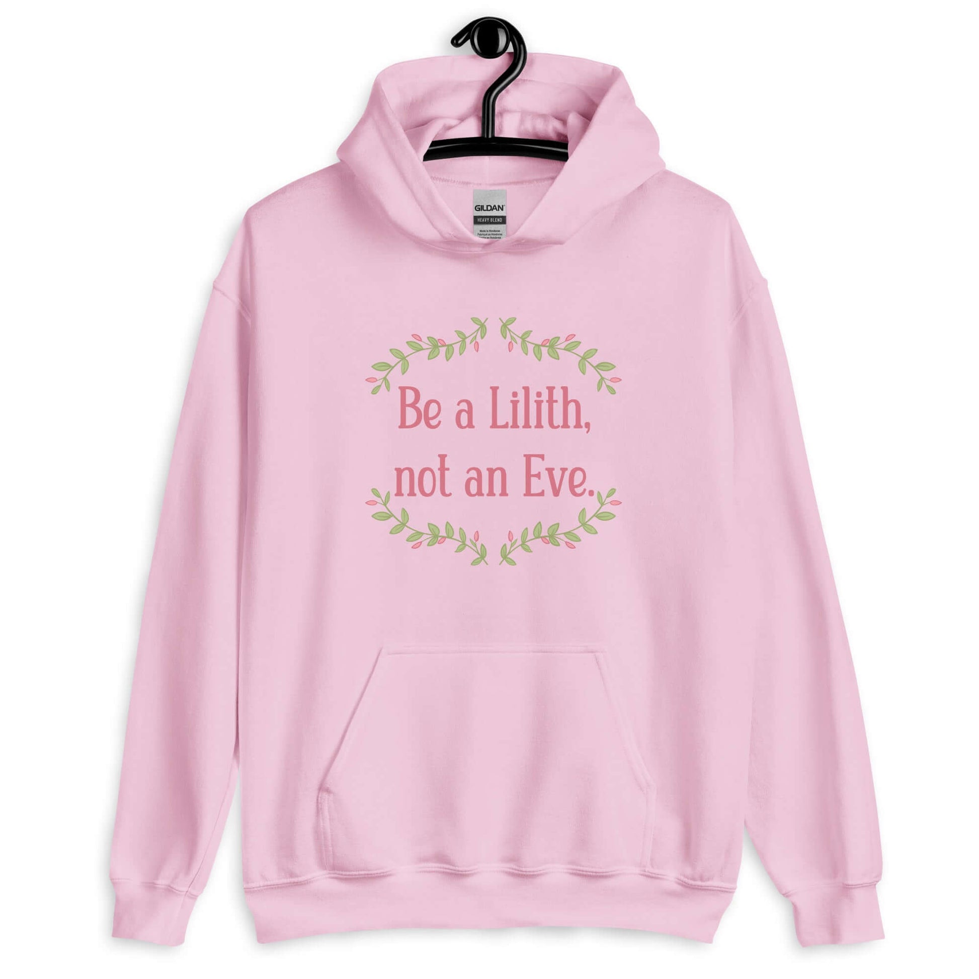 Light pink hoodie sweatshirt with the phrase Be a Lilith, not an Eve printed on the front. The text is pink and had a green floral vine graphic framing the text. 