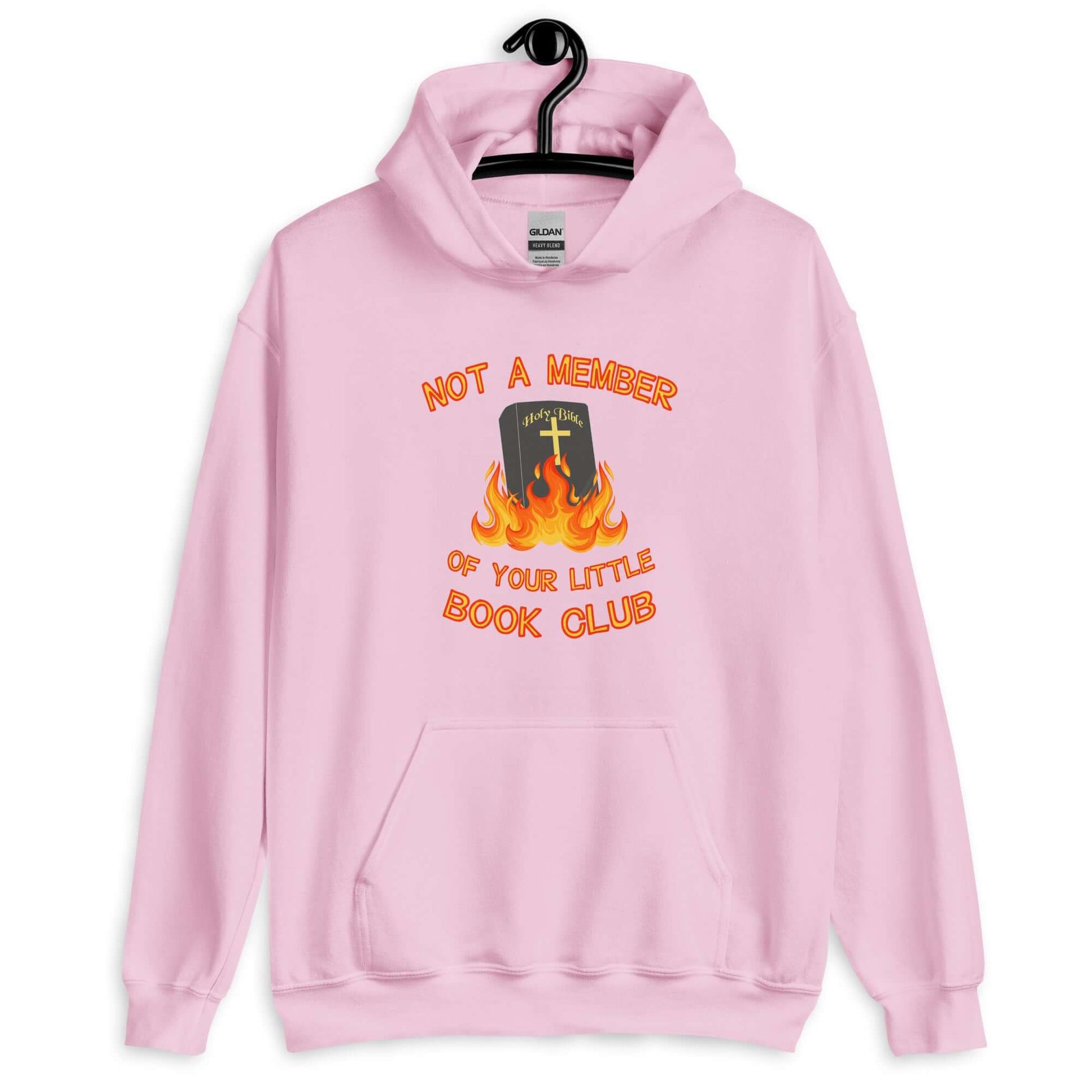 Light pink hoodie sweatshirt with image of a burning bible and the words Not a member of your little book club printed on the front.