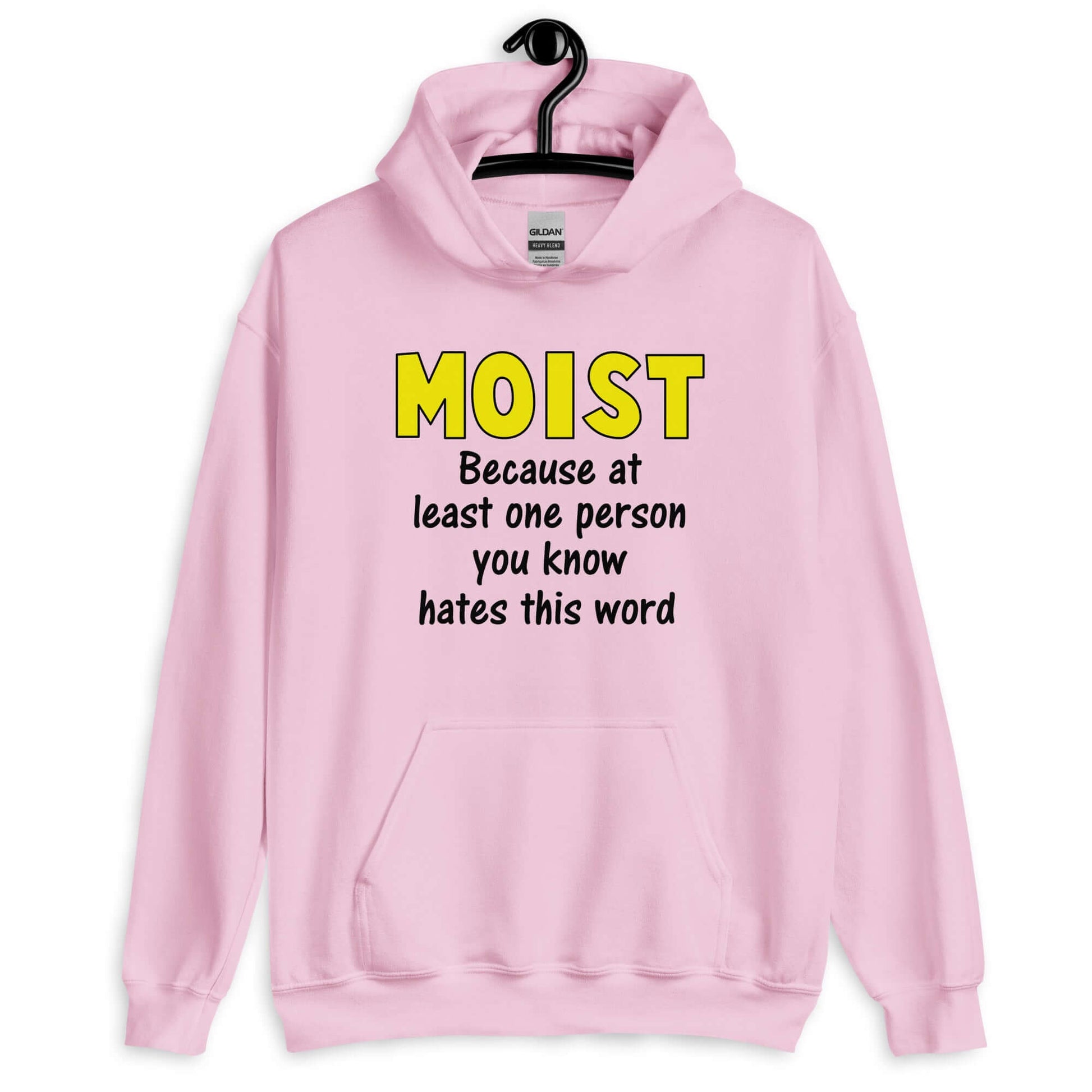 Light pink hoodie sweatshirt with the word Moist printed in large yellow bold font. In smaller font under the word moist is the phrase Because at least one person you know hates this word.