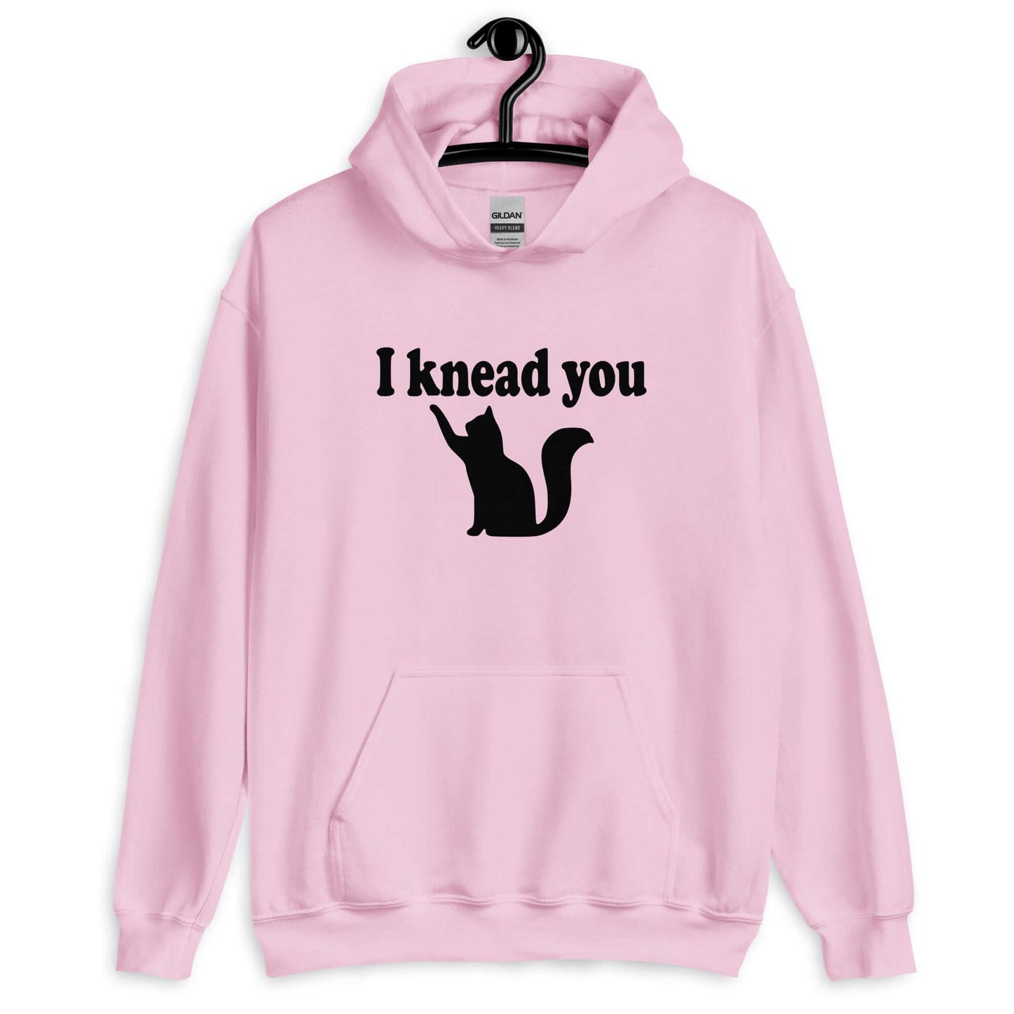 Light pink hoodie sweatshirt that has an image of a silhouette of a cat and the words I knead you printed on the front.