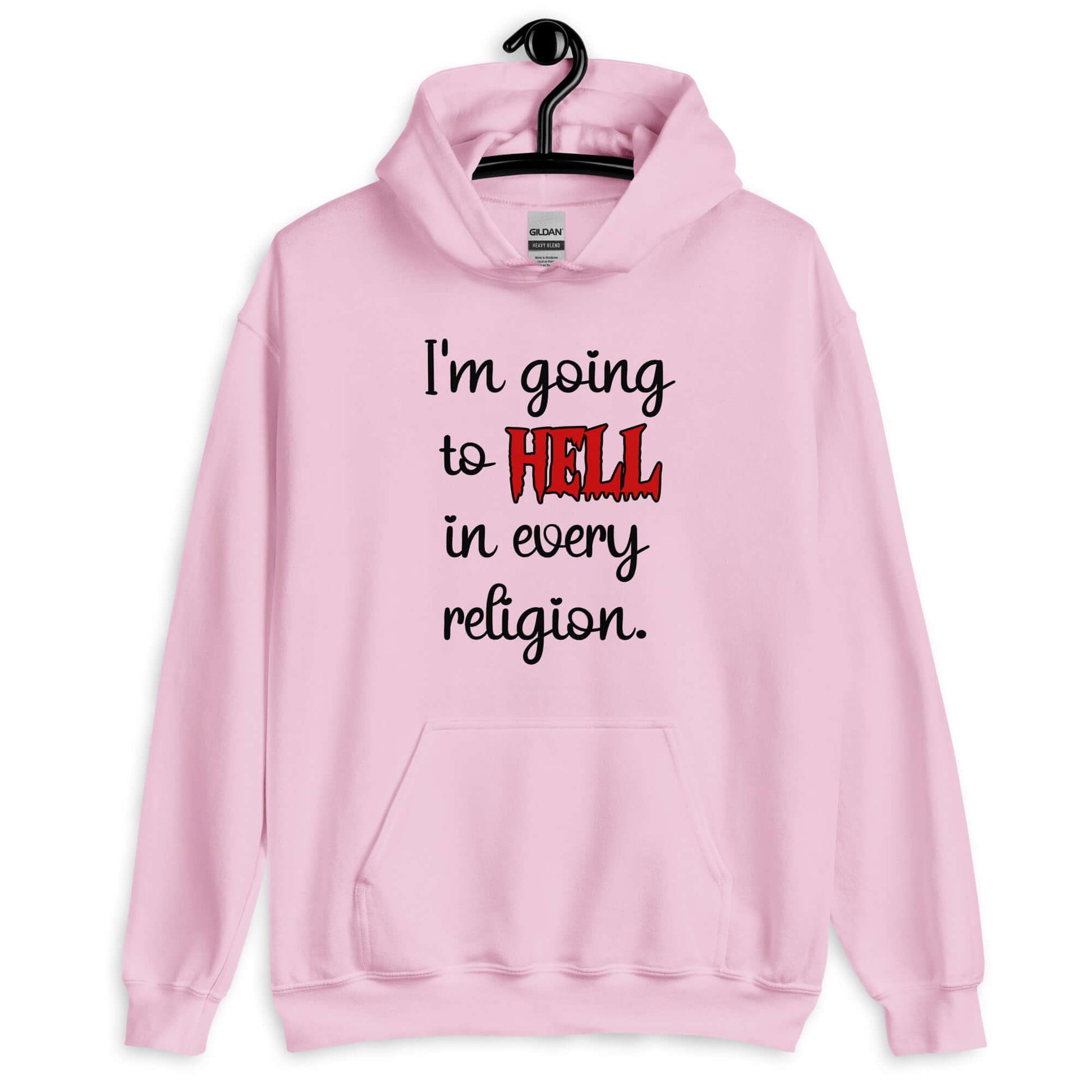 Light pink hoodie sweatshirt with the phrase I'm going to hell in every religion printed on the front. The word hell is printed in red. The rest of the text is black.