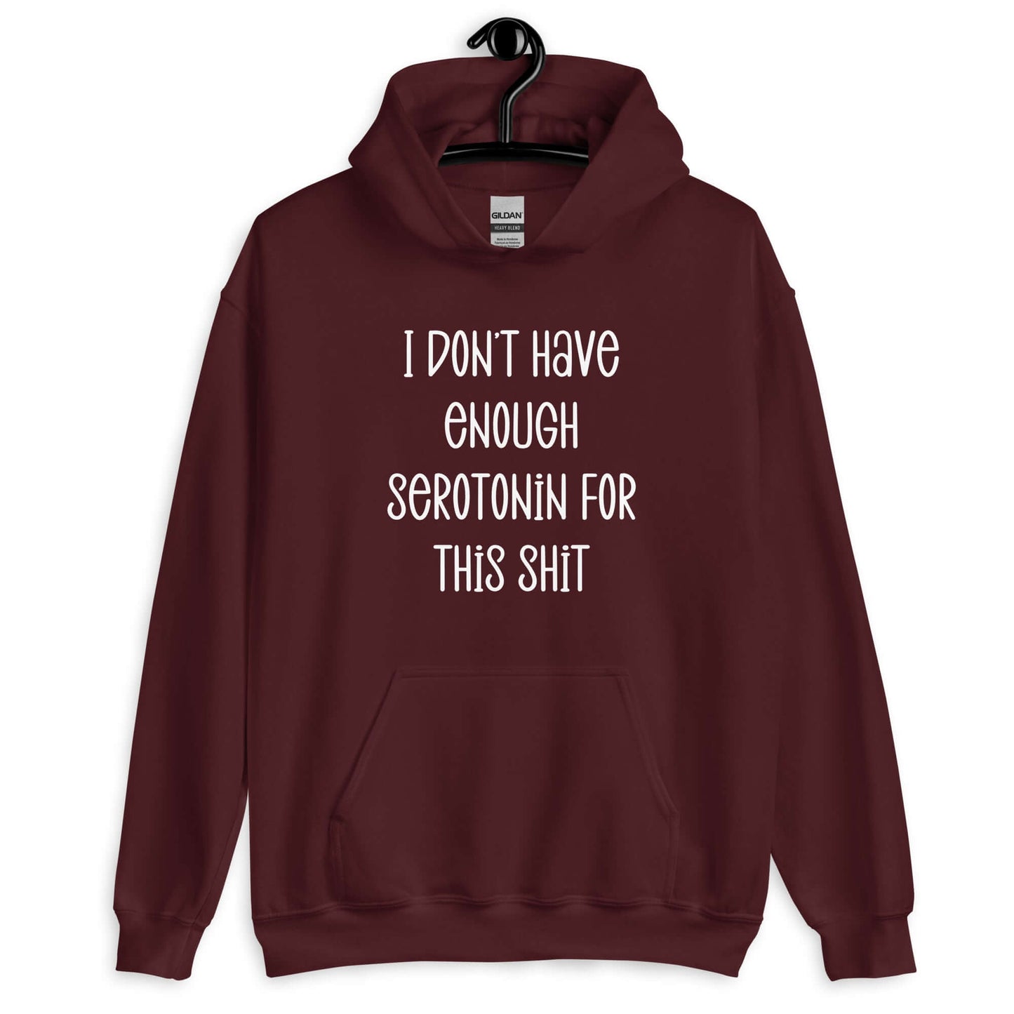 Marooon hoodie sweatshirt with the words I don't have enough serotonin for this shit printed on the front.