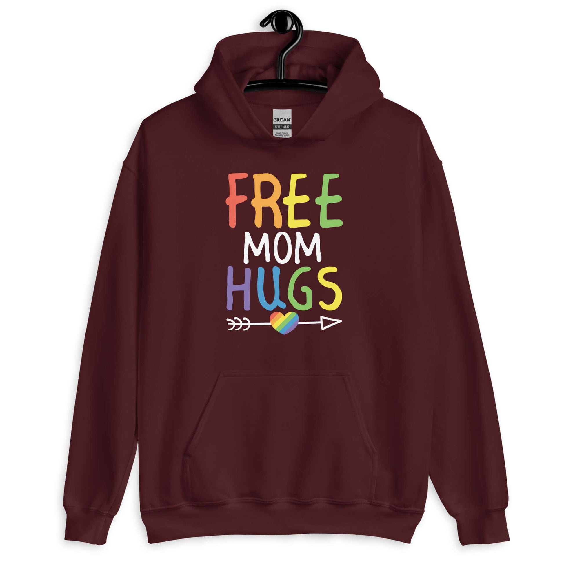 Maroon hoodie sweatshirt with the phrase Free Mom hugs in rainbow lettering printed on the front.