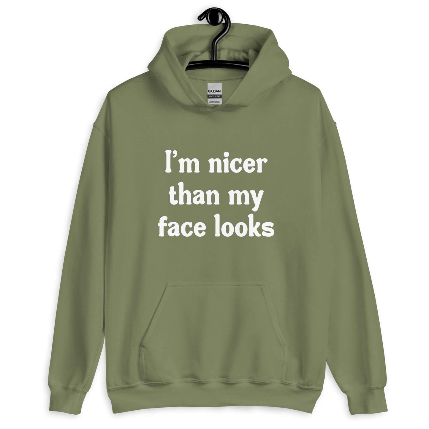 Military green hoodie sweatshirt with the phrase I'm nicer than my face looks printed on the front.