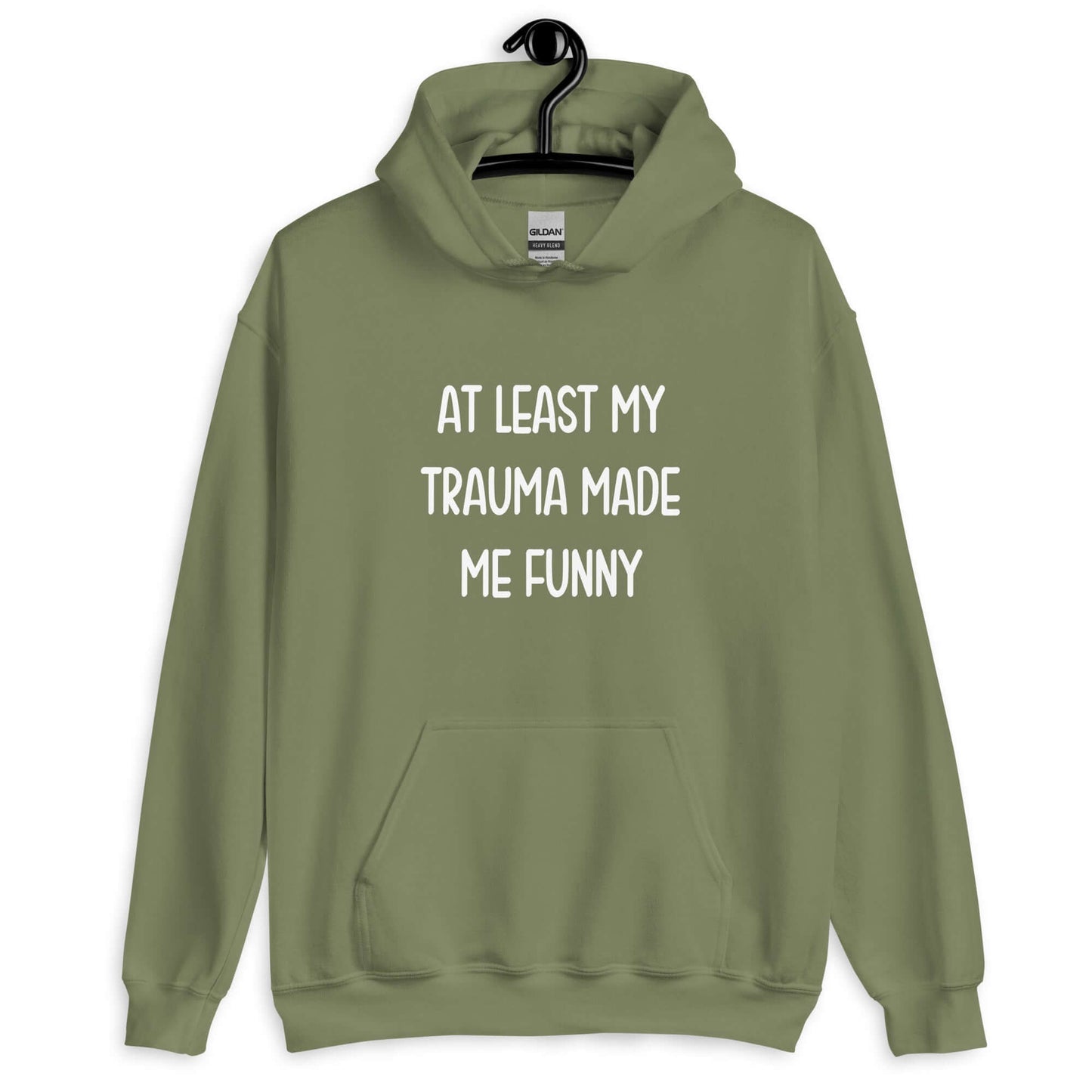 Military green hoodie sweatshirt with the words At least my trauma made me funny printed on the front.