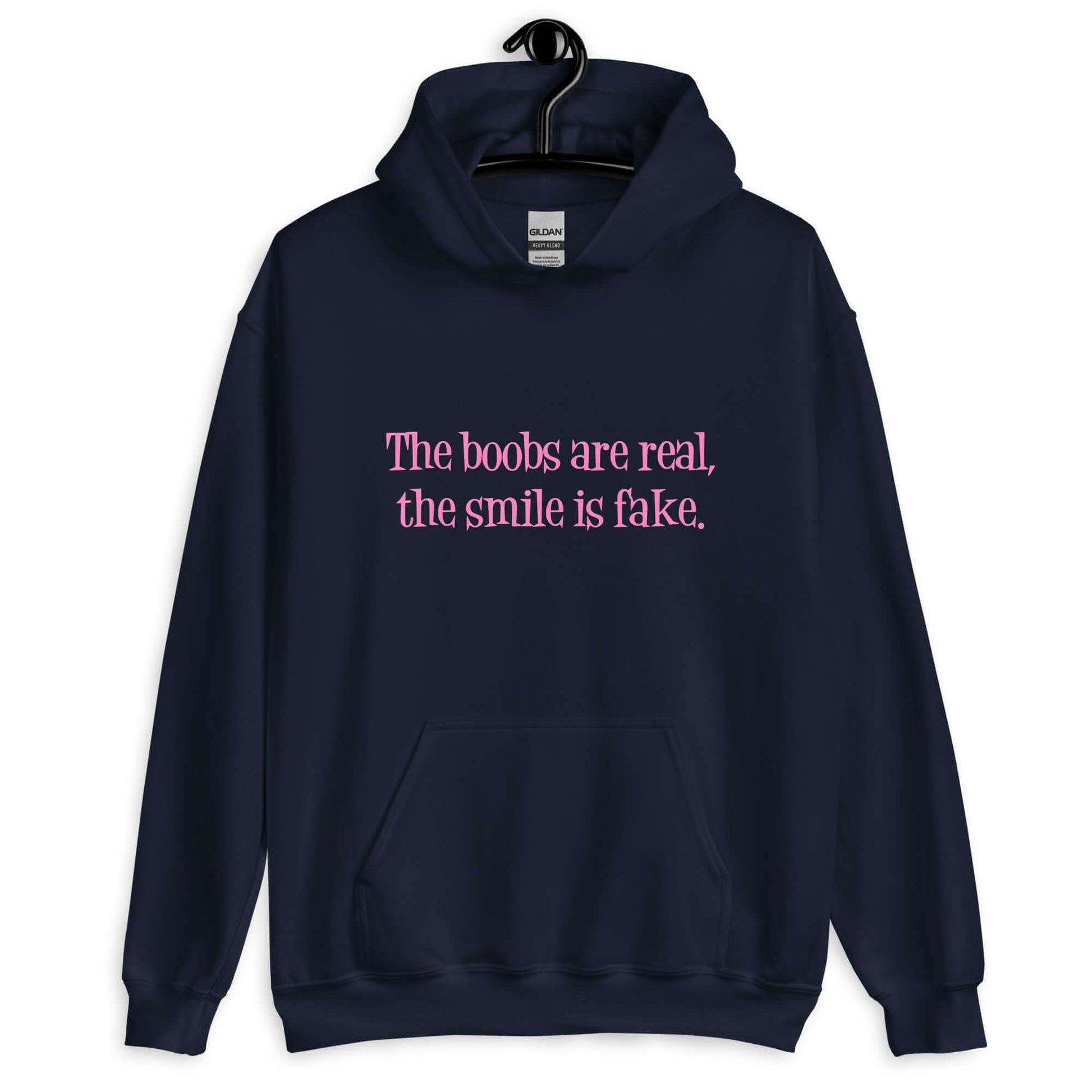 Navy blue hoodie sweatshirt with the phrase The boobs are real, the smile is fake printed in pink on the front.