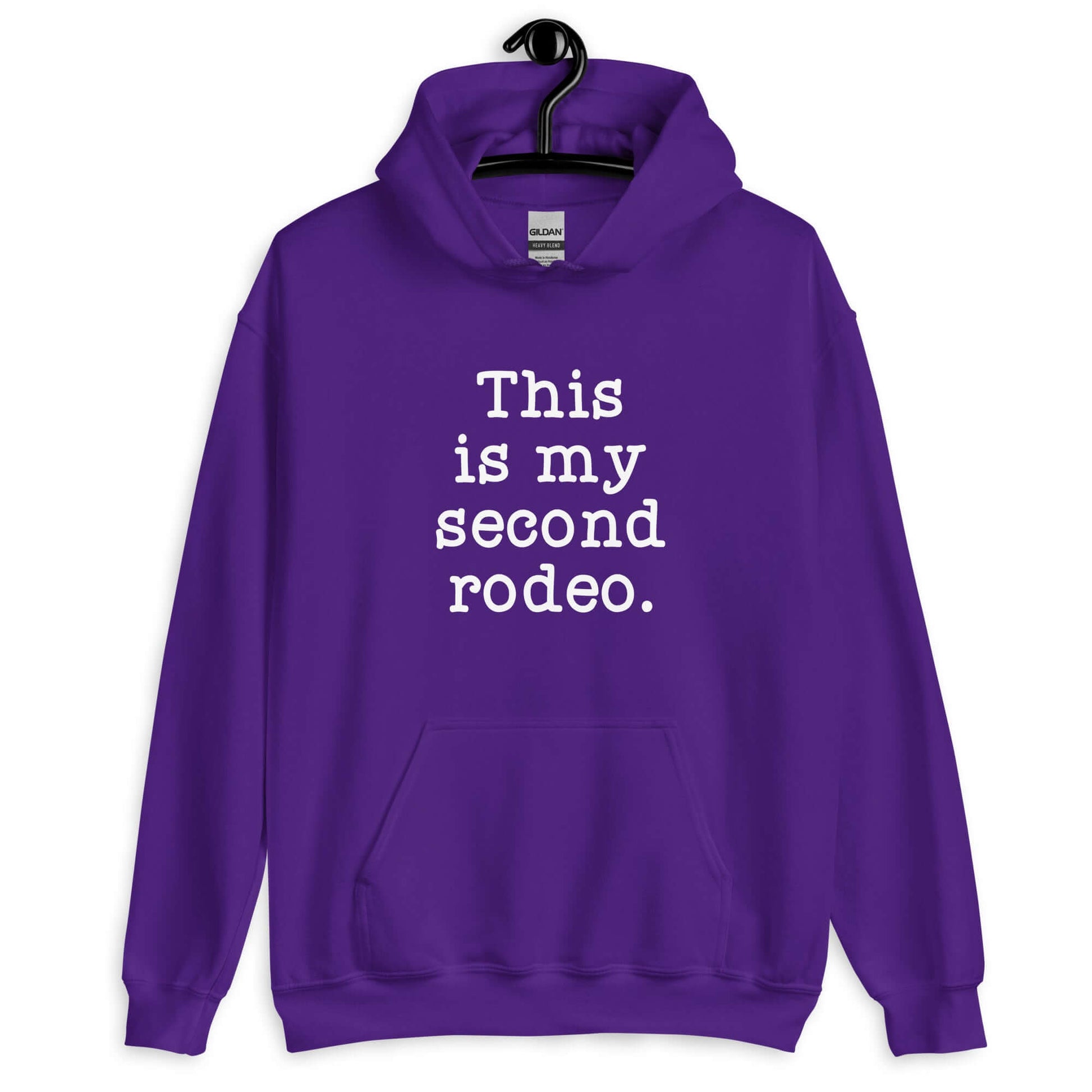 Purple hoodie sweatshirt with the funny phrase This is my second rodeo printed on the front.