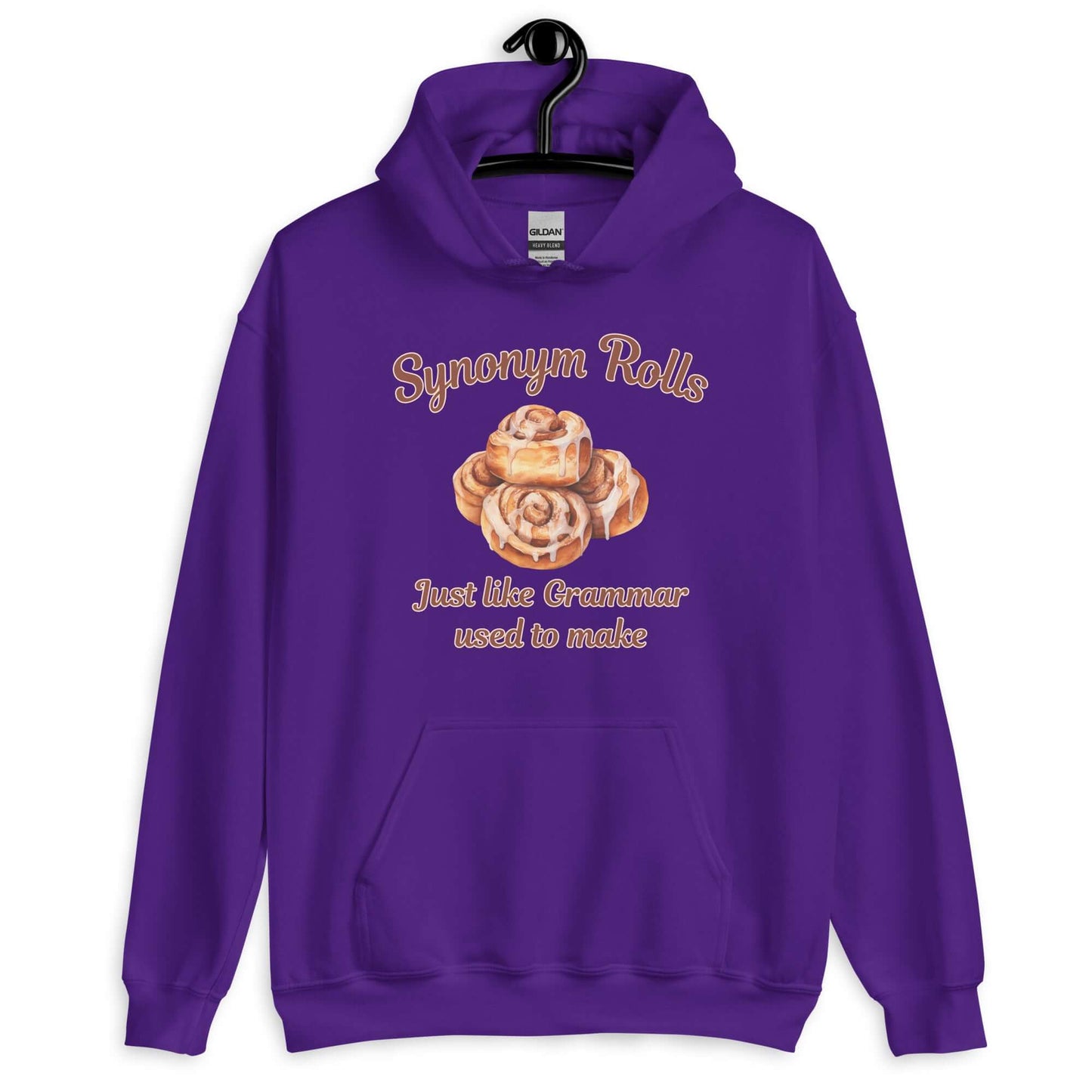 Purple hoodie sweatshirt with an image of cinnamon rolls and the pun phrase Synonym rolls Just like Grammar used to make printed on the front.
