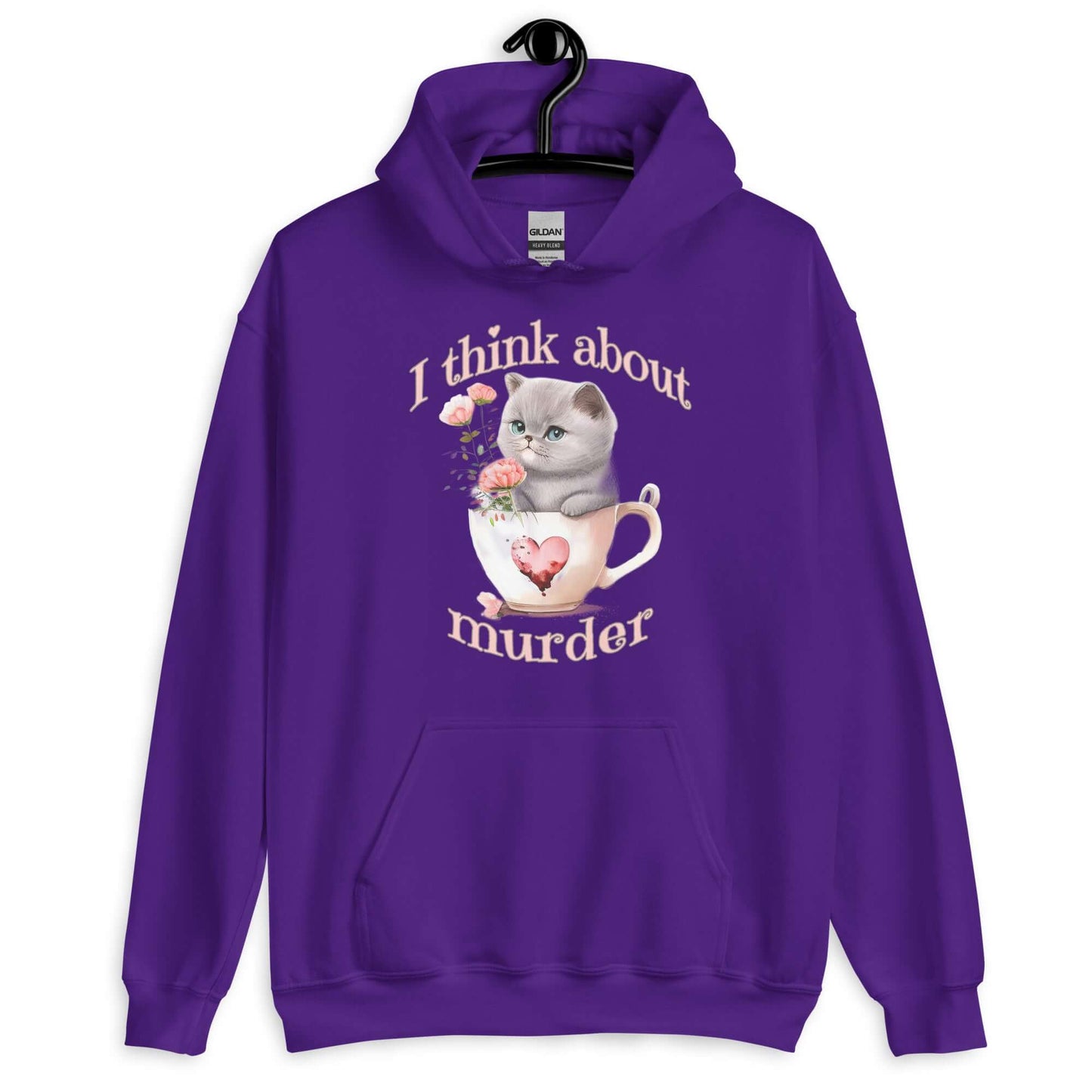 Purple hoodie sweatshirt that says I think about murder with image of cute fluffy kitten sitting in a teacup printed on the front.