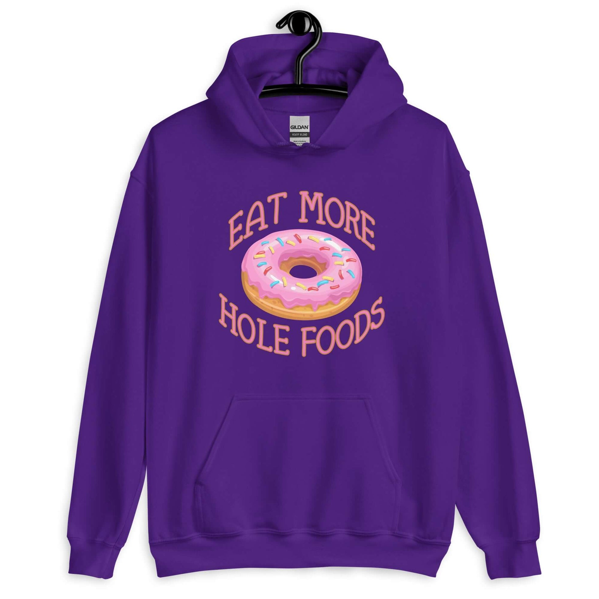 Purple hoodie sweatshirt with an image of a donut with pink icing and sprinkles and the words Eat more hole foods printed on the front.