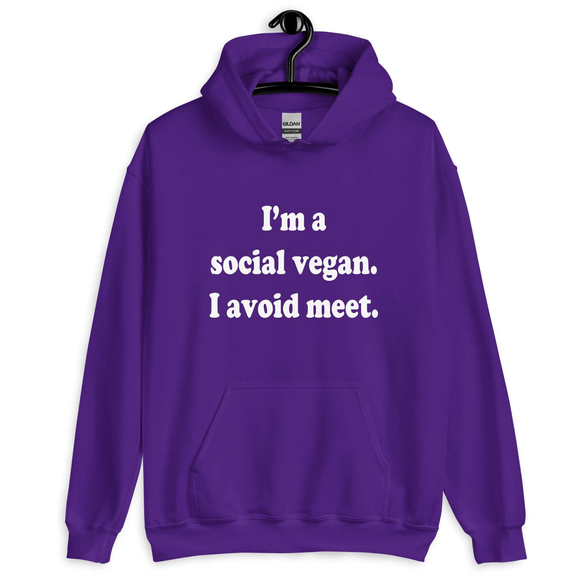 Purple hoodie sweatshirt with the pun phrase I'm a social vegan, I avoid meet printed on the front.