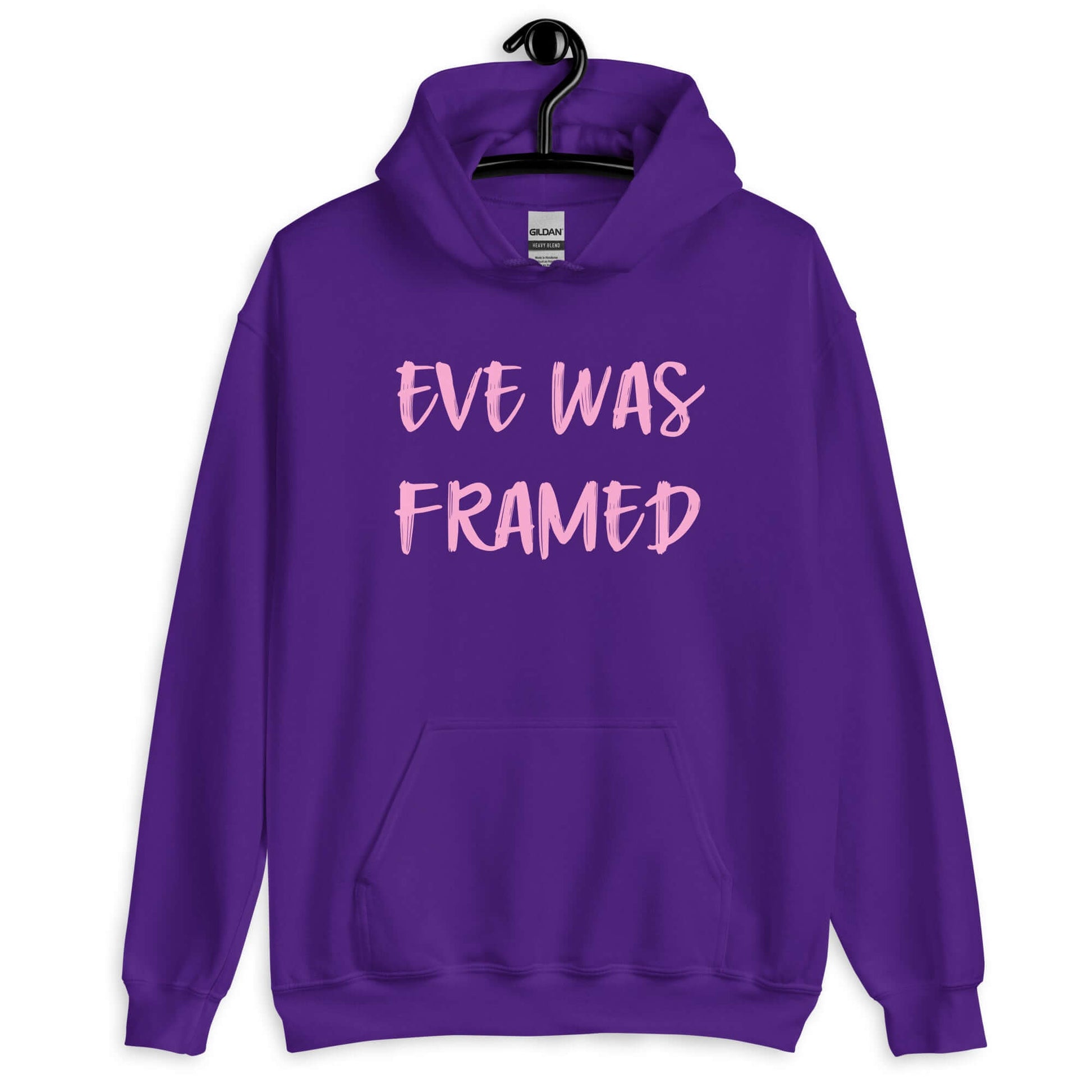 Purple hoodie sweatshirt with the words Eve was framed printed on the front in pink.