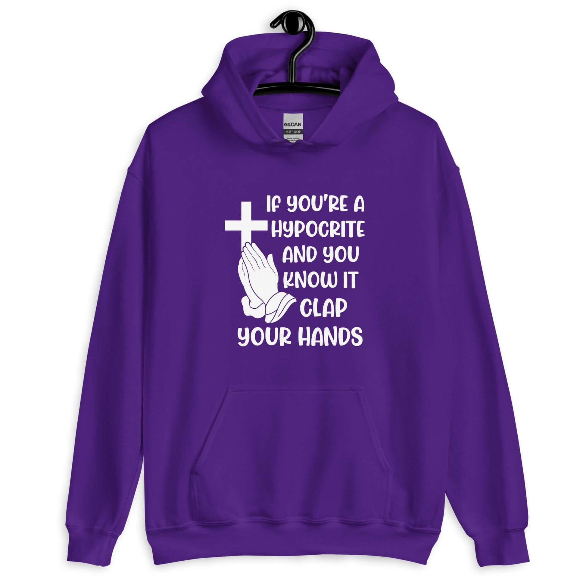 Purple hoodie sweatshirt with image of a cross and praying hands & the phrase If you're a hypocrite and you know it clap your hands printed on the front.