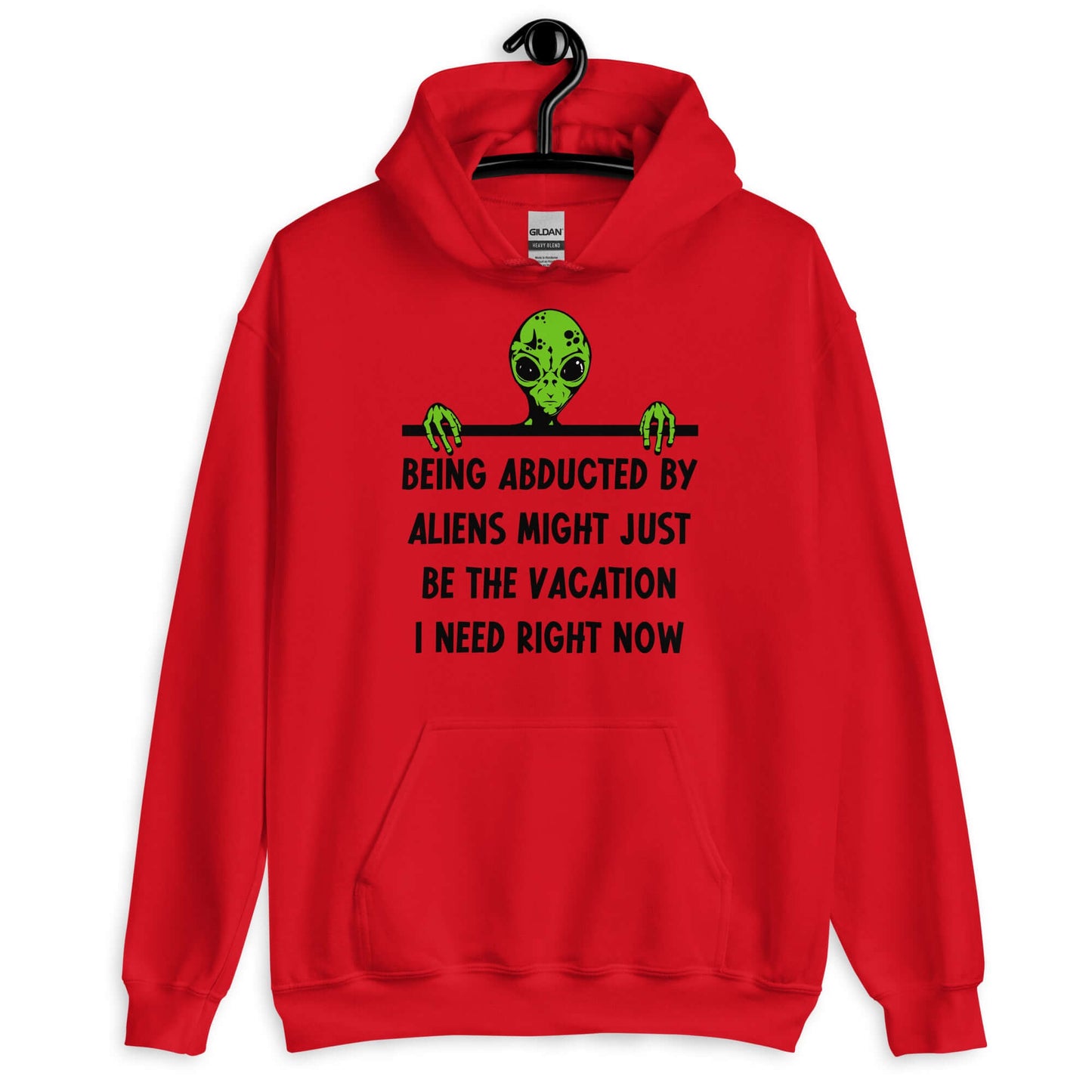 Red hoodie with an image of a green alien and the phrase Being abducted by aliens might just be the vacation I need right now printed on the front of the sweatshirt.