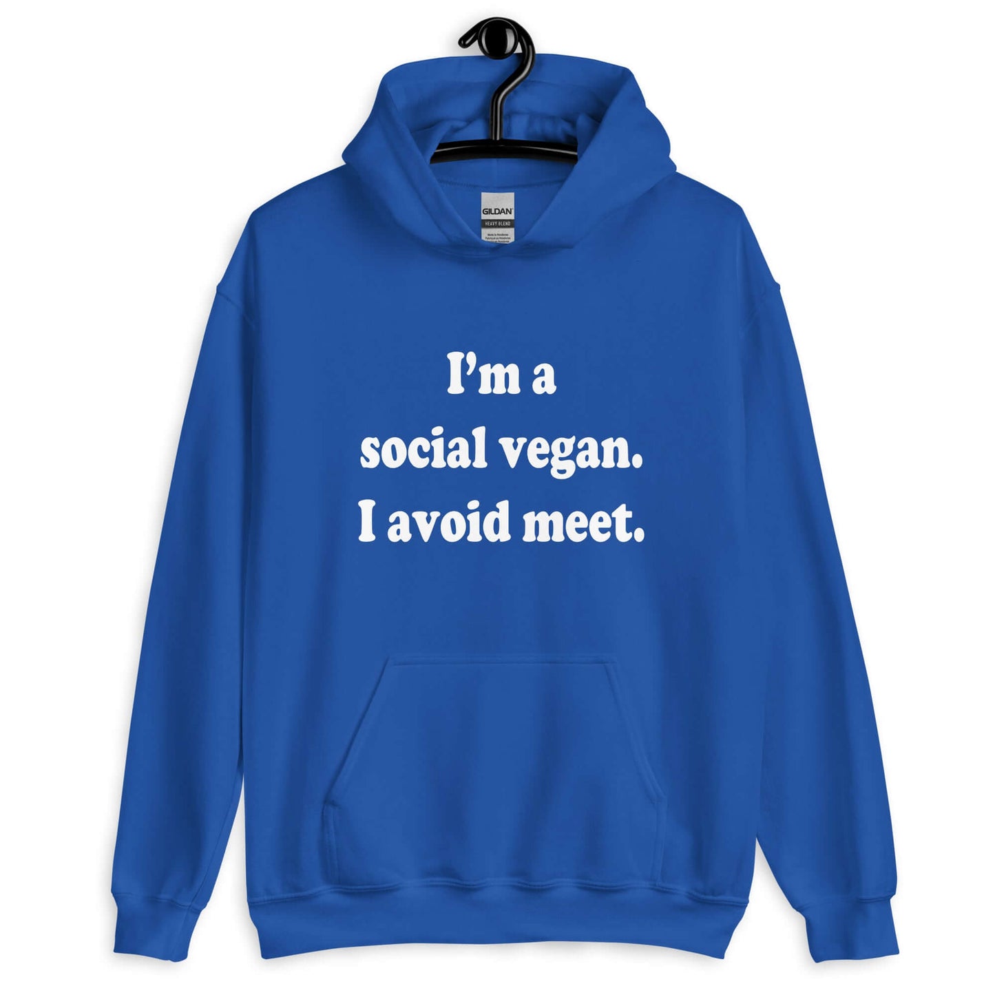 Royal blue hoodie sweatshirt with the pun phrase I'm a social vegan, I avoid meet printed on the front.