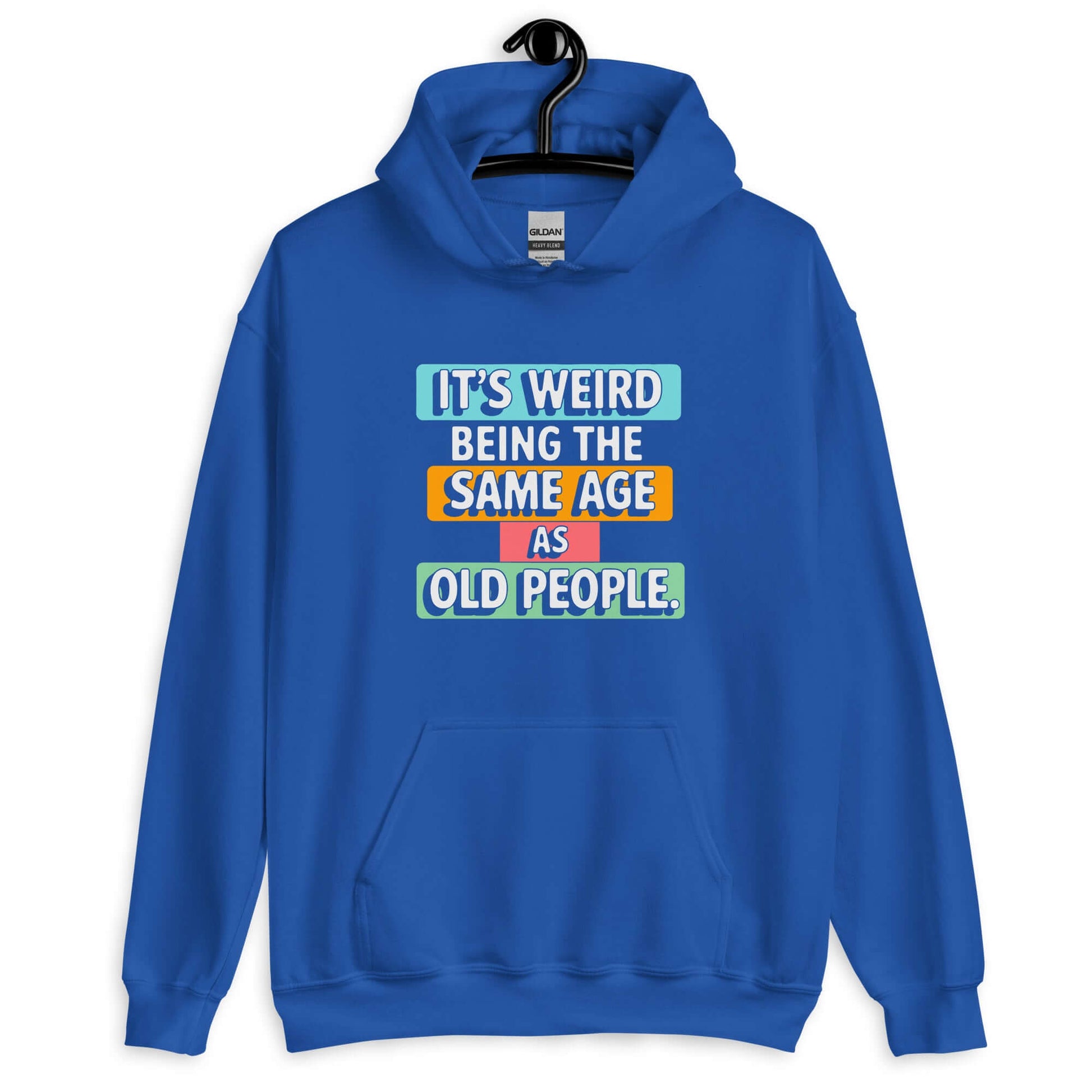 Royal blue hoodie sweatshirt with colorful graphics that say It's weird being the same age as old people printed on the front.