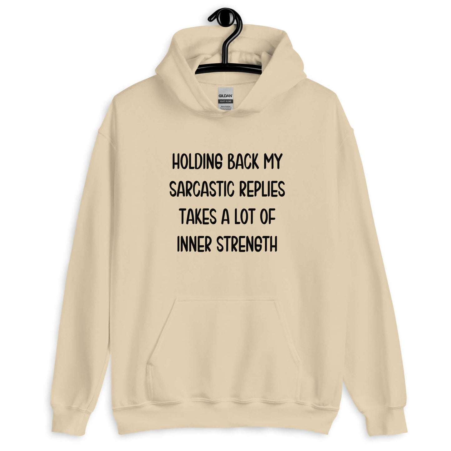 Sand hoodie sweatshirt with the phrase Holding back my sarcastic replies takes a lot of inner strength printed on the front.