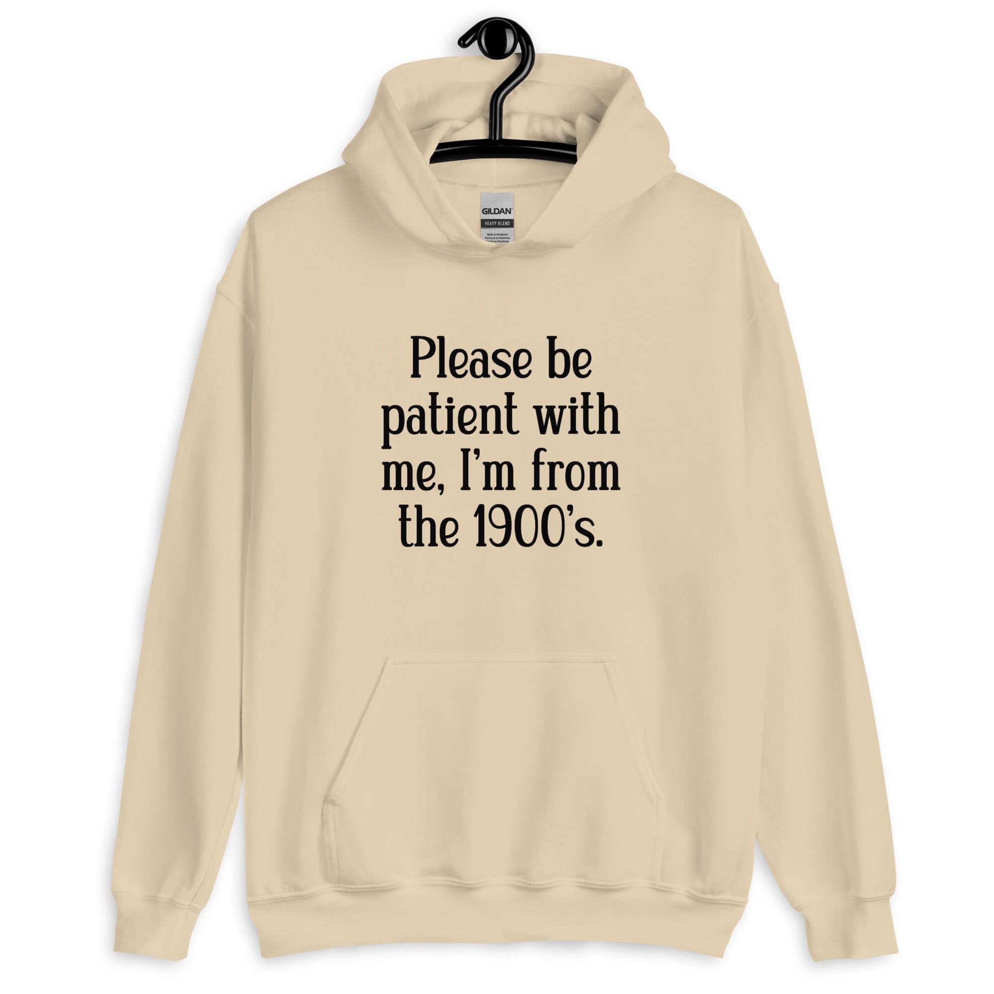 Sand hoodie sweatshirt with the phrase Please be patient with me, I'm from the 1900s printed on the front.