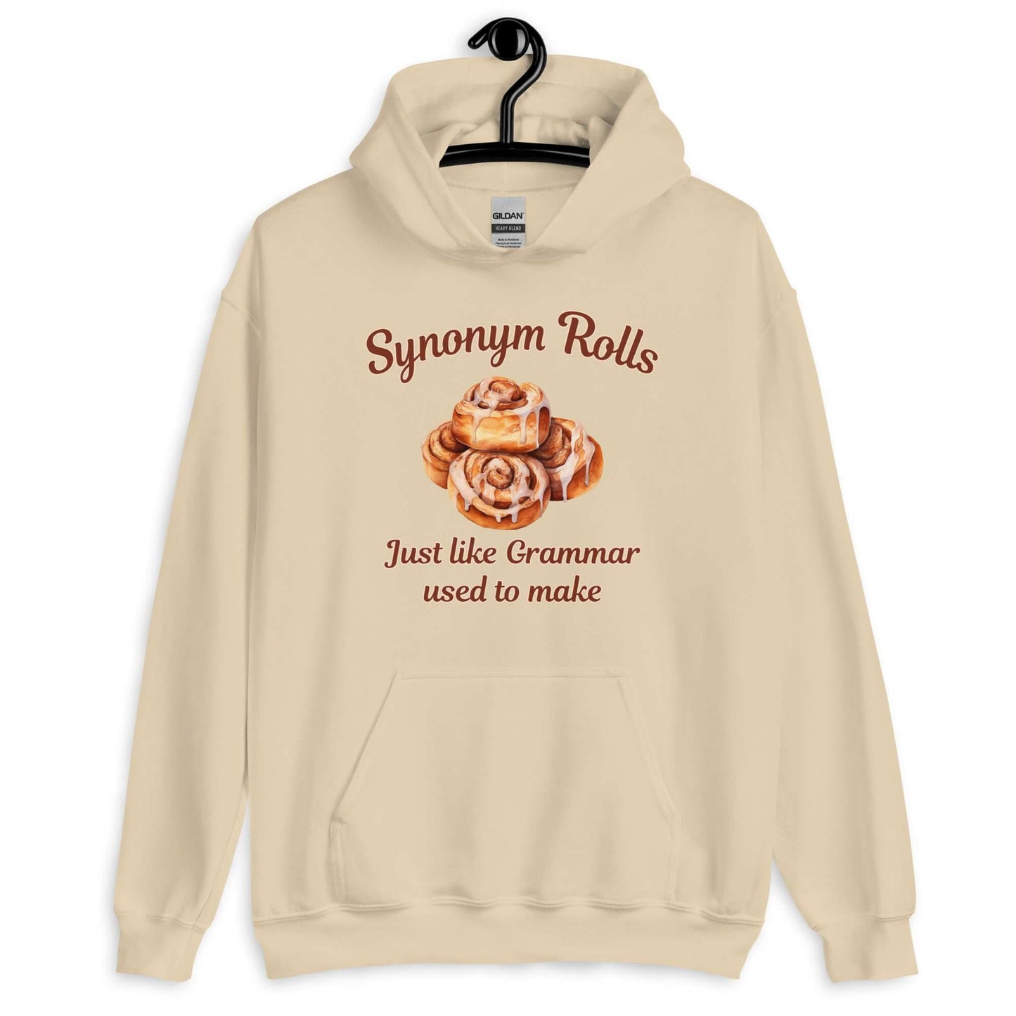 Sand hoodie sweatshirt with an image of cinnamon rolls and the pun phrase Synonym rolls Just like Grammar used to make printed on the front.