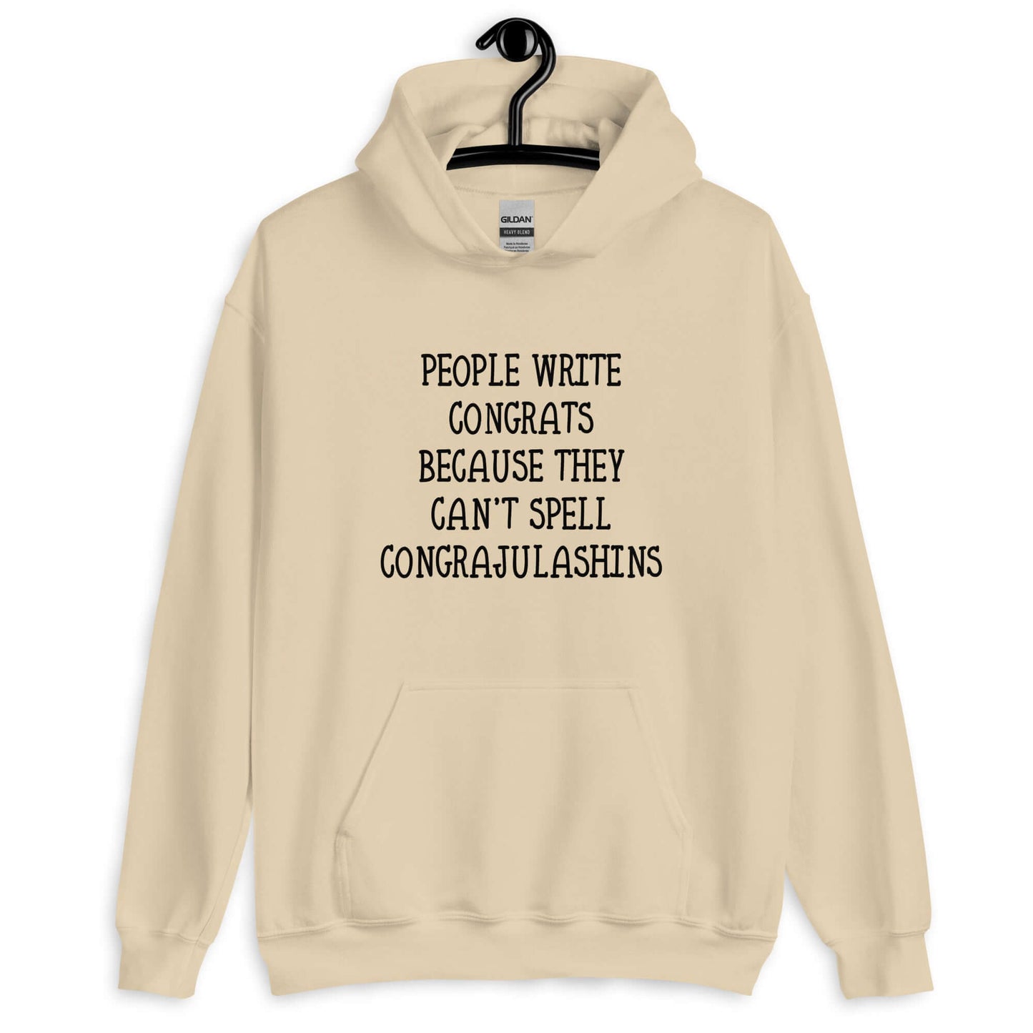 Sand hoodie sweatshirt with the words People write congrats because they can't spell congratulations printed on the front. The word congratulations is intentionally misspelled.