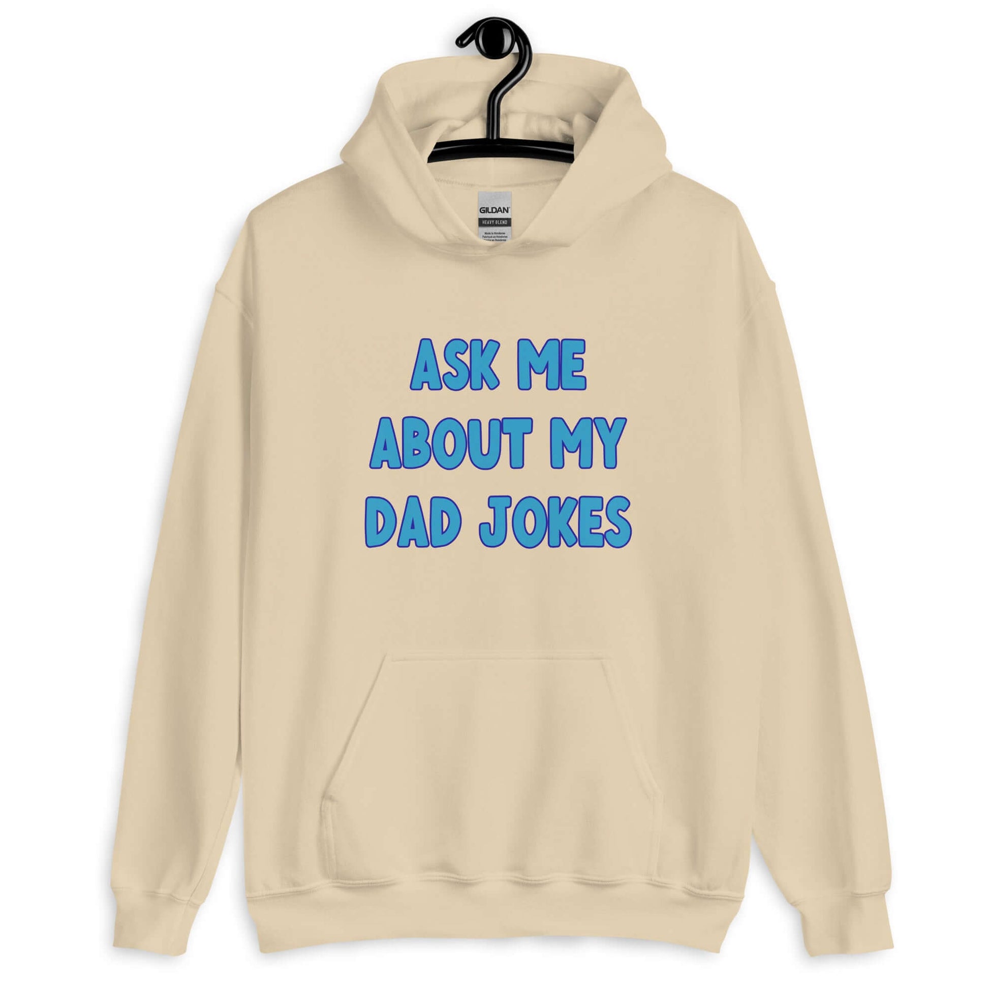 Sand color hoodie sweatshirt with the words Ask me about my Dad jokes printed on the front.