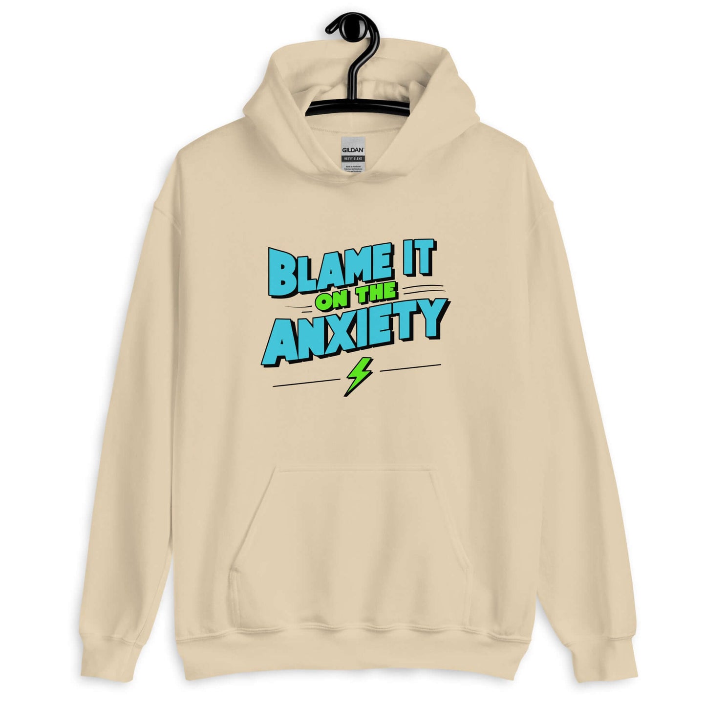 Sand color hoodie sweatshirt with the phrase Blame is on the anxiety printed on the front. The graphics are bold and in aqua and lime green.