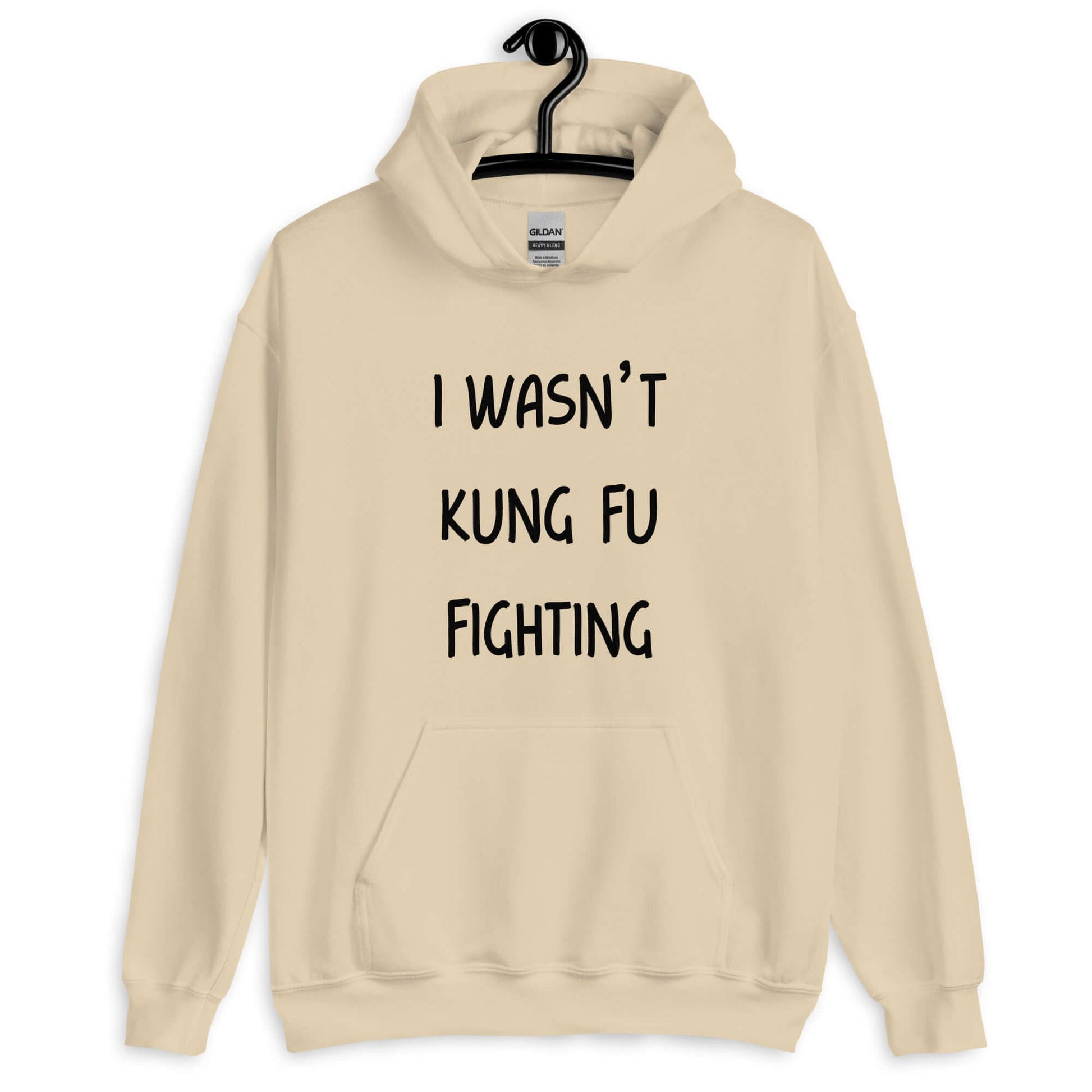 Sand color hoodie sweatshirt with the funny phrase I wasn't kung fu fighting printed on the front.