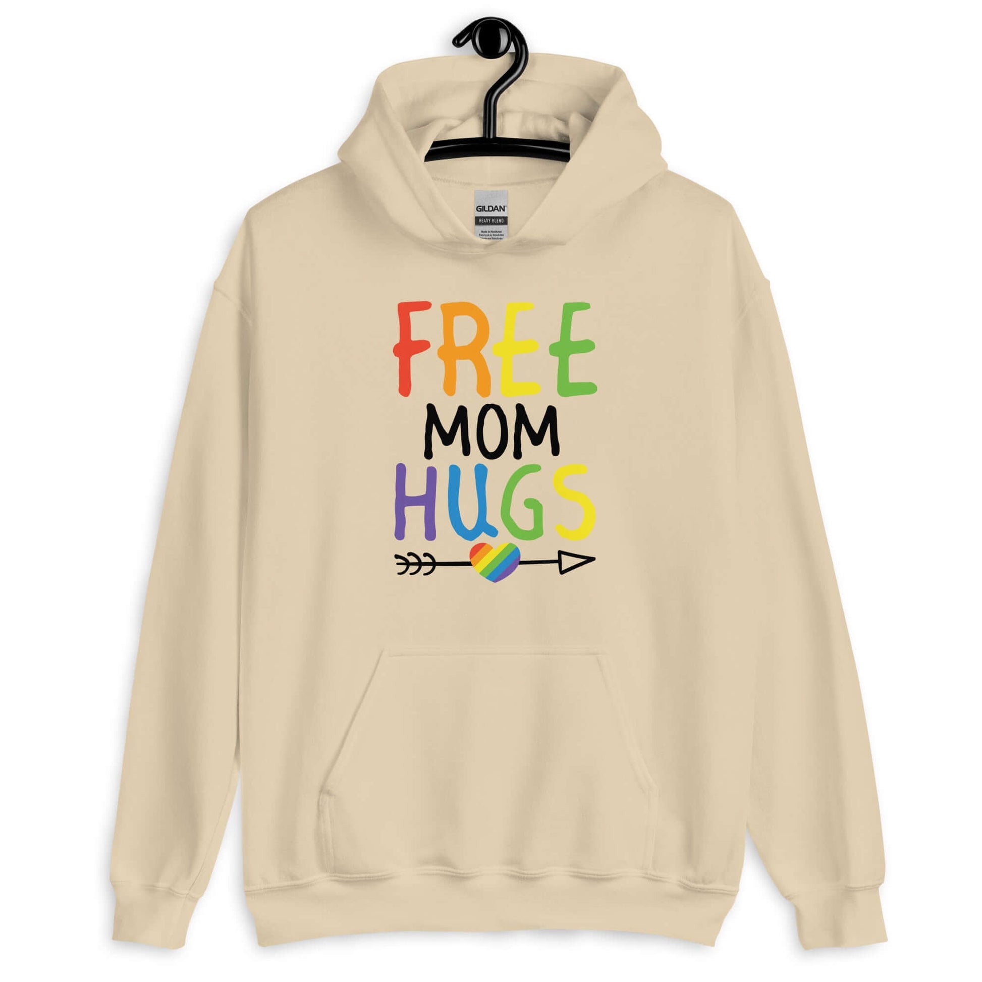 Sand color hoodie sweatshirt with the phrase Free Mom hugs in rainbow lettering printed on the front.