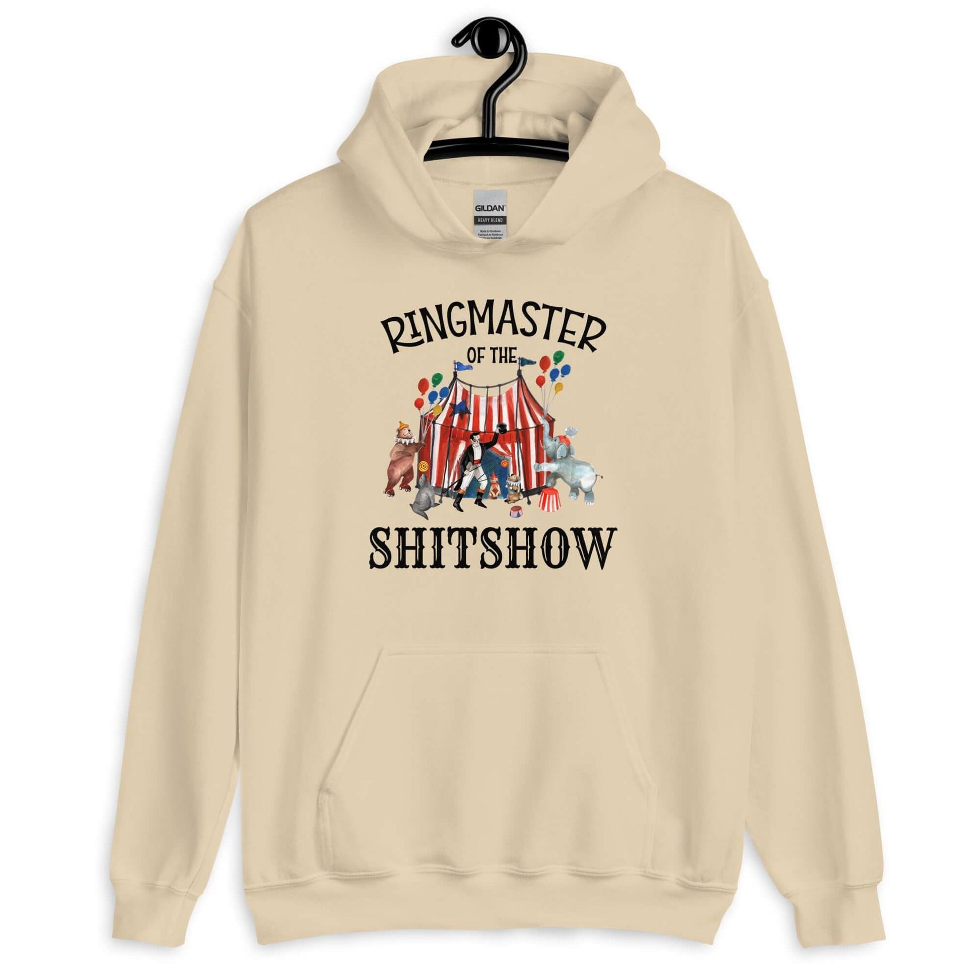 Sand hoodie sweatshirt with a circus theme graphic and the words Ringmaster of the Shitshow printed on the front.