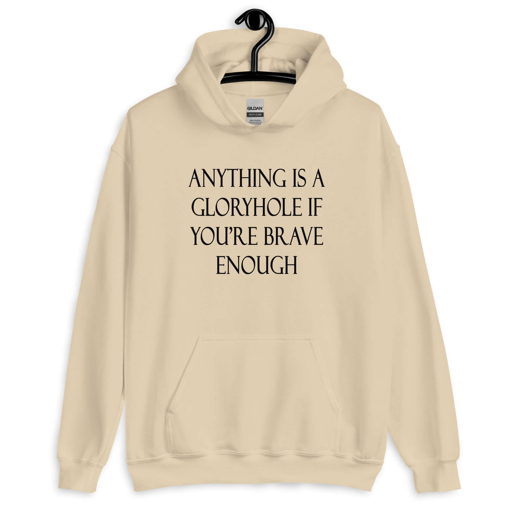 Sand hoodie sweatshirt with the phrase Anything is a gloryhole if you're brave enough printed on the front.