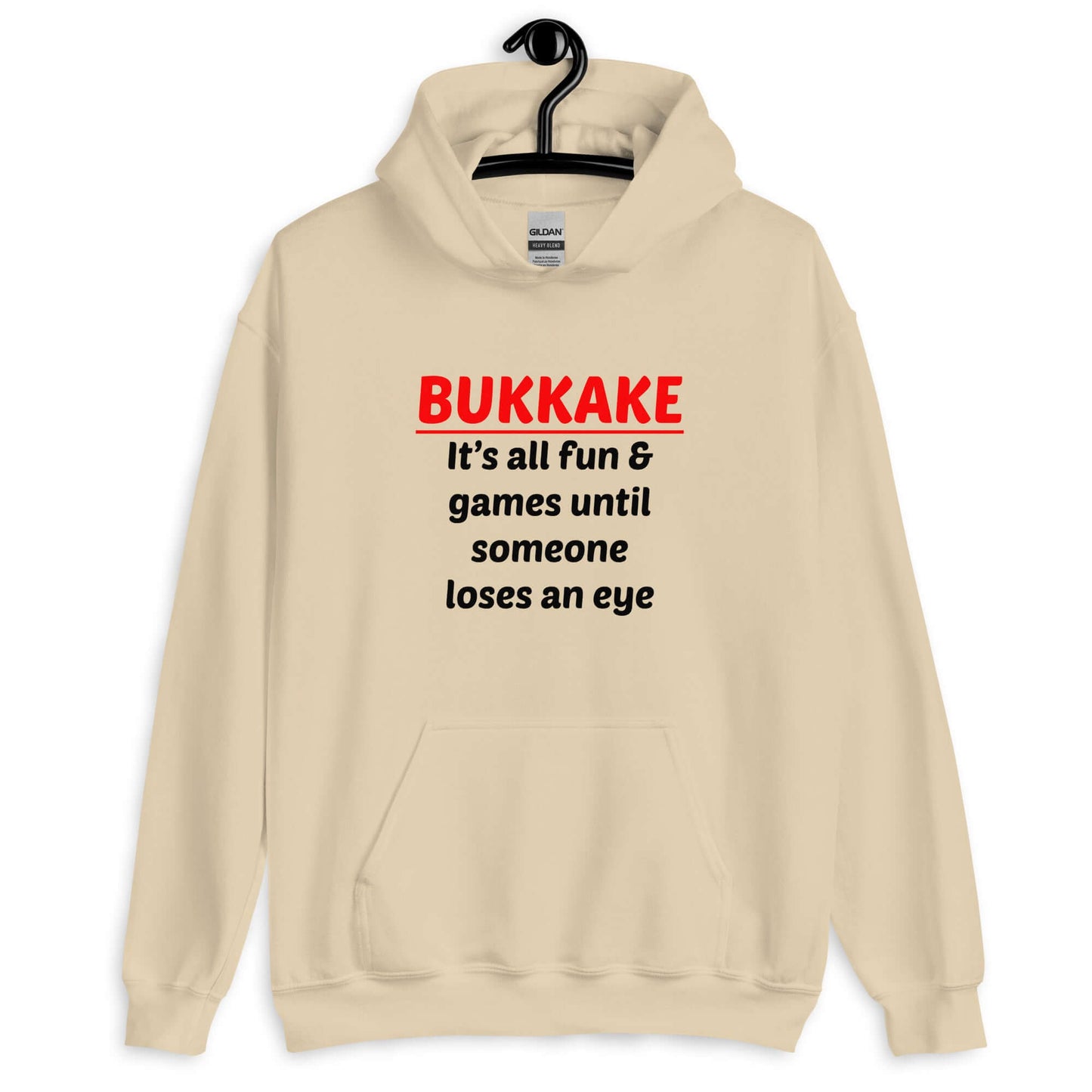 Sand color hoodie sweatshirt with the phrase Bukkake it's all fun & games until someone loses an eye printed on the front.