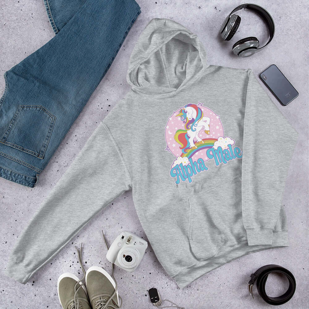 Sport grey hoodie sweatshirt with funny pastel rainbow unicorn graphics and the words Alpha Male printed on the front.