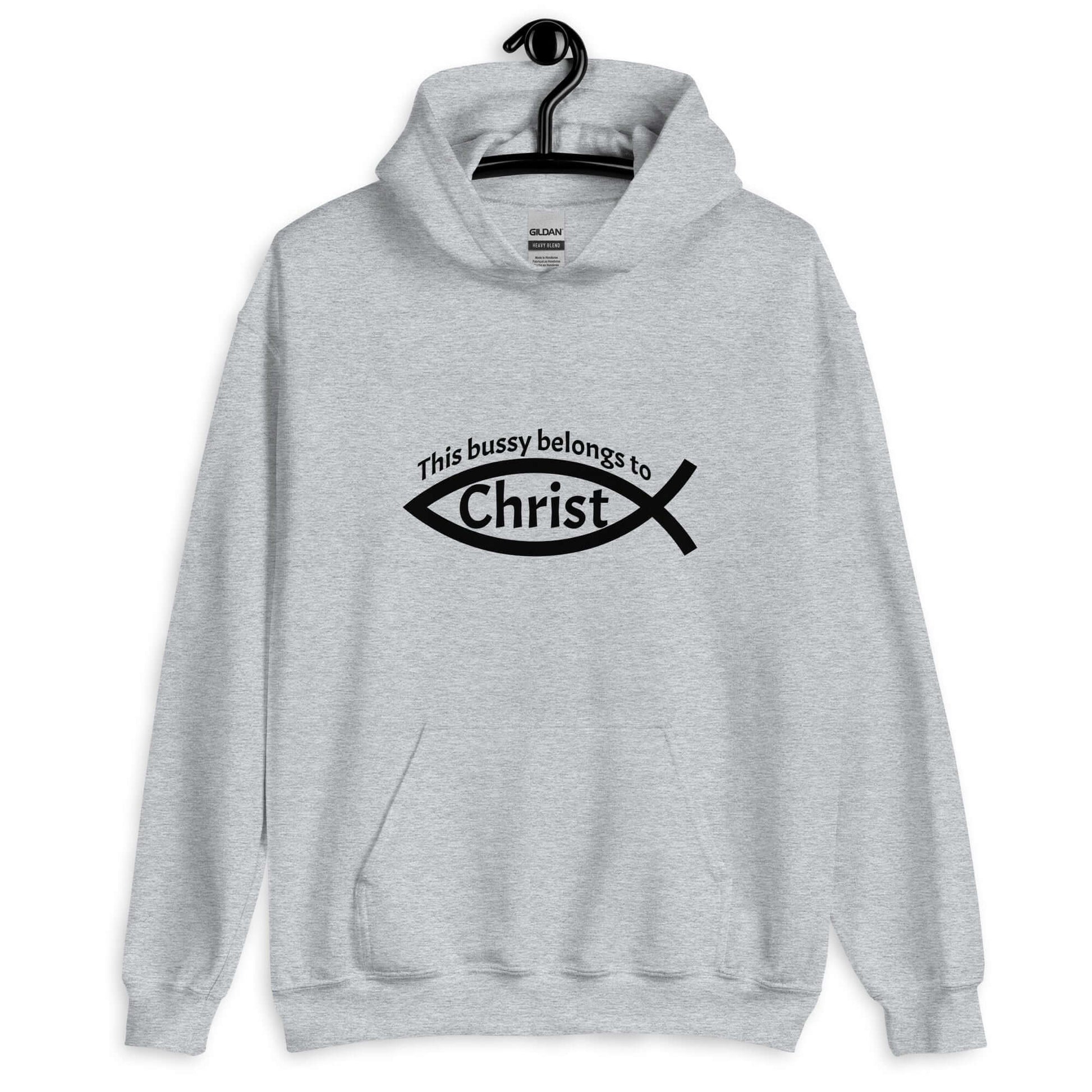 Sport grey hoodie sweatshirt with This bussy belongs to Christ inside of a Christian fish symbol printed on the front.