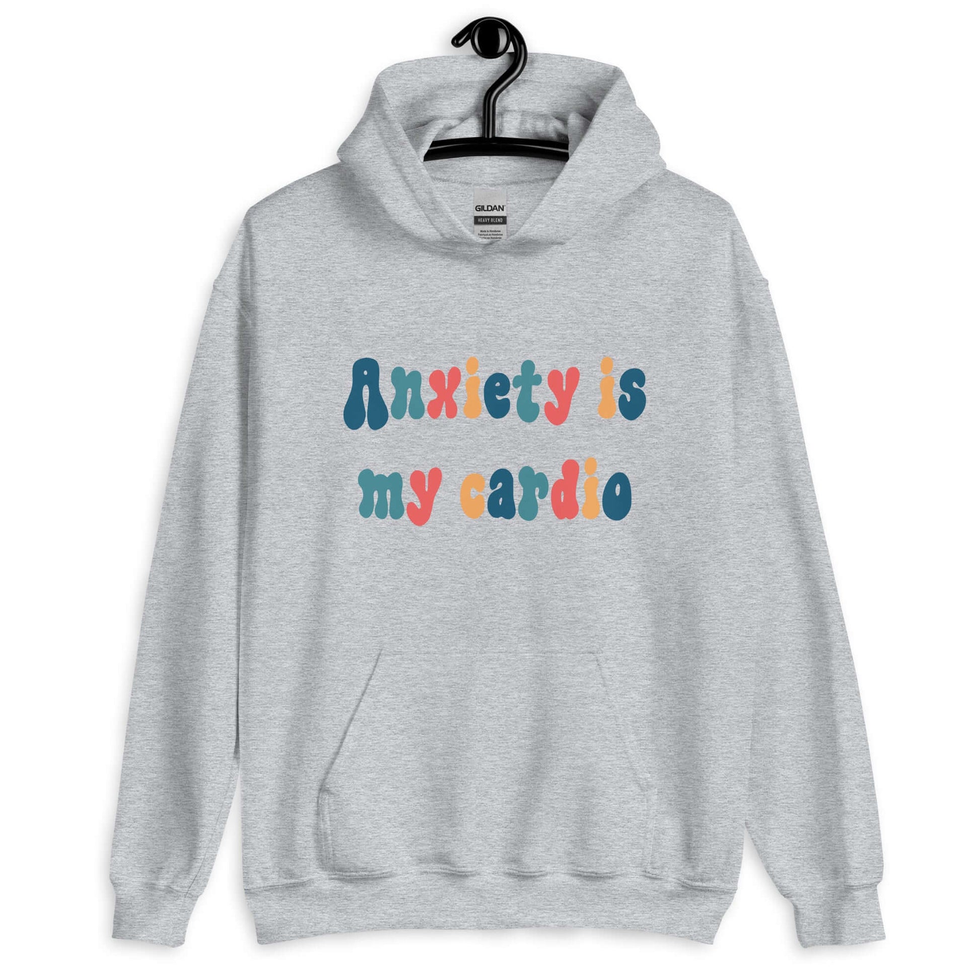 Sport grey hoodie sweatshirt with the phrase Anxiety is my cardio printed in multiple colors on the front of the hoodie.