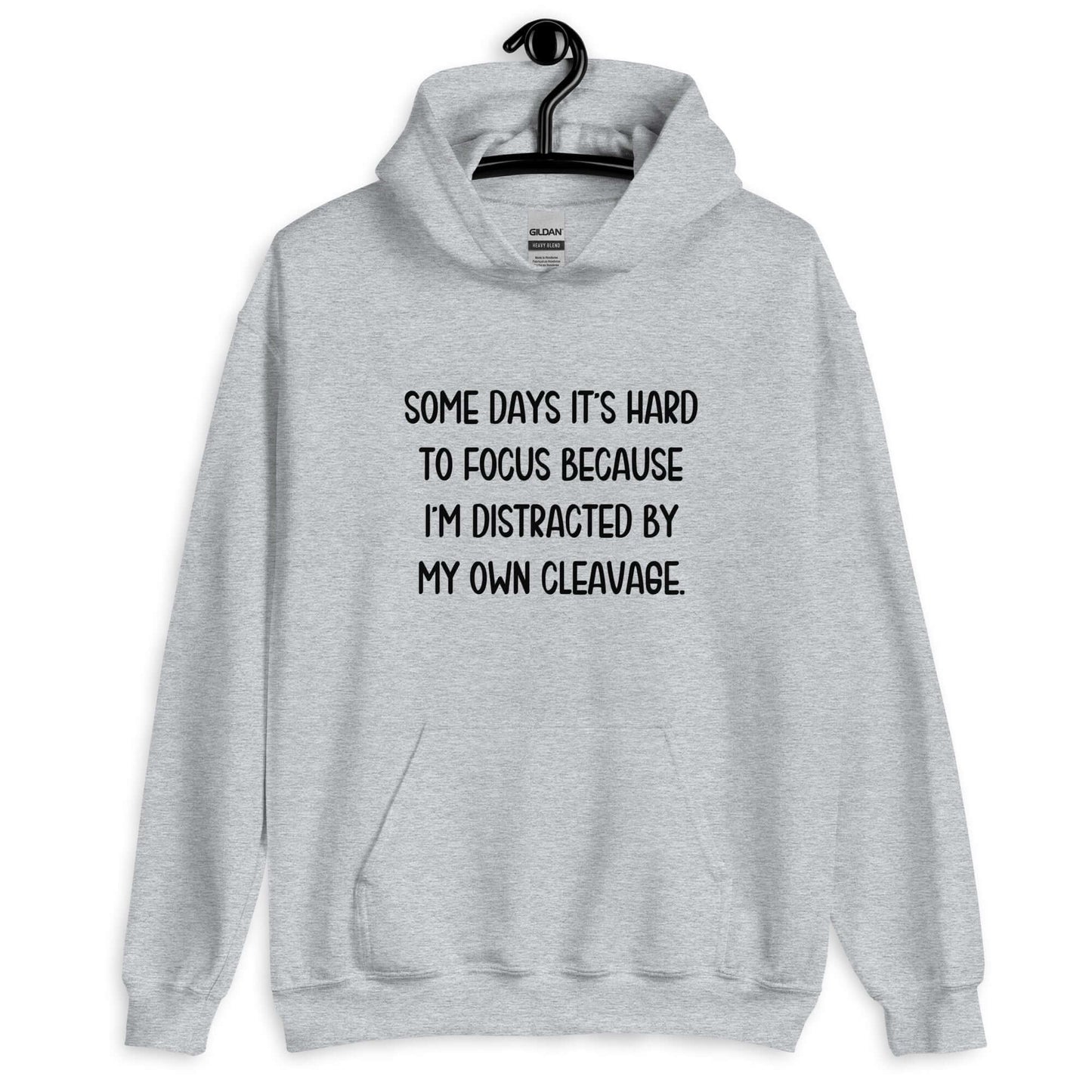 Light sport grey hoodie sweatshirt with the phrase Some days it's hard to focus because I'm distracted by my own cleavage printed on the front.